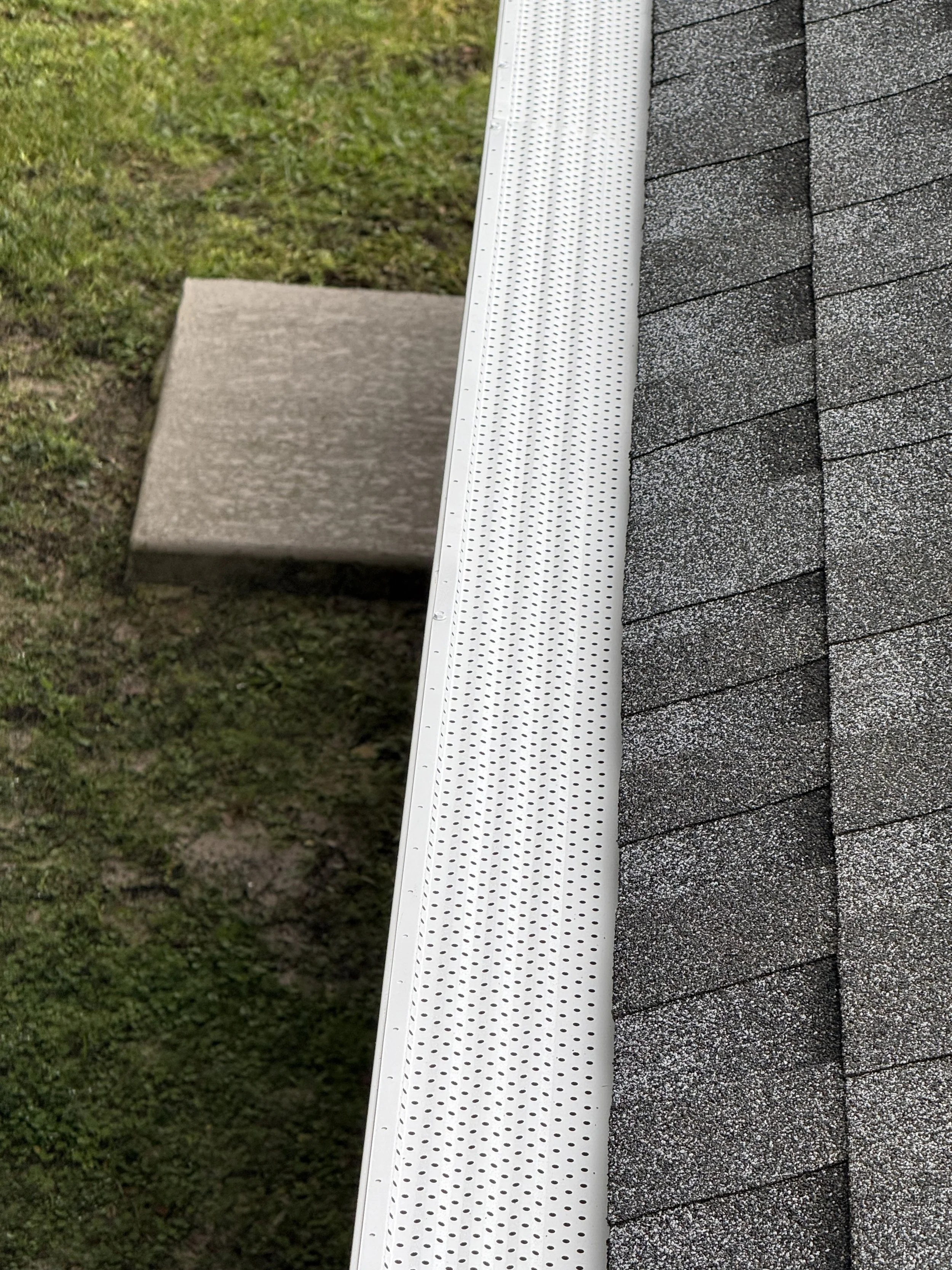White gutter guard installed on seamless gutter system in Dunnellon