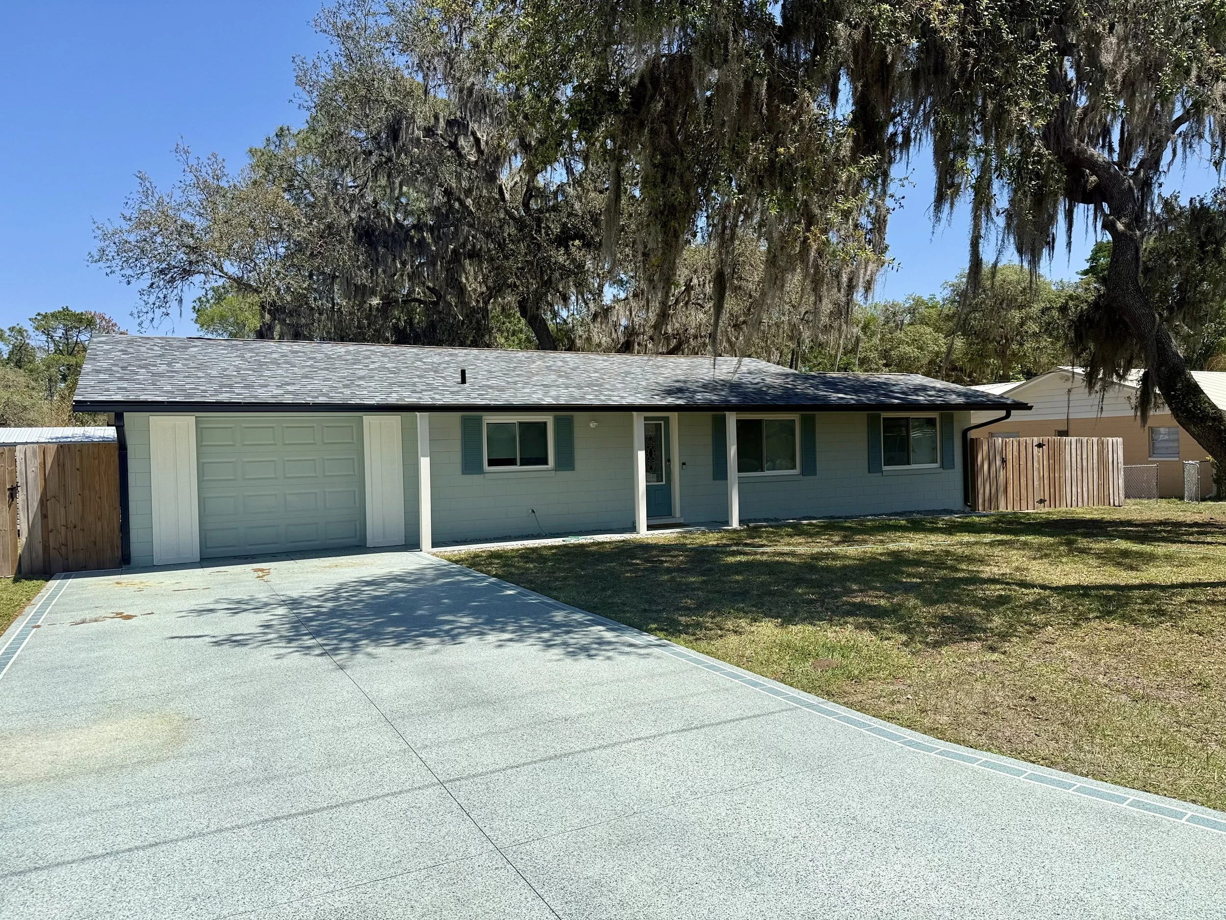 Black seamless gutters installed on front of home in Umatilla, Florida