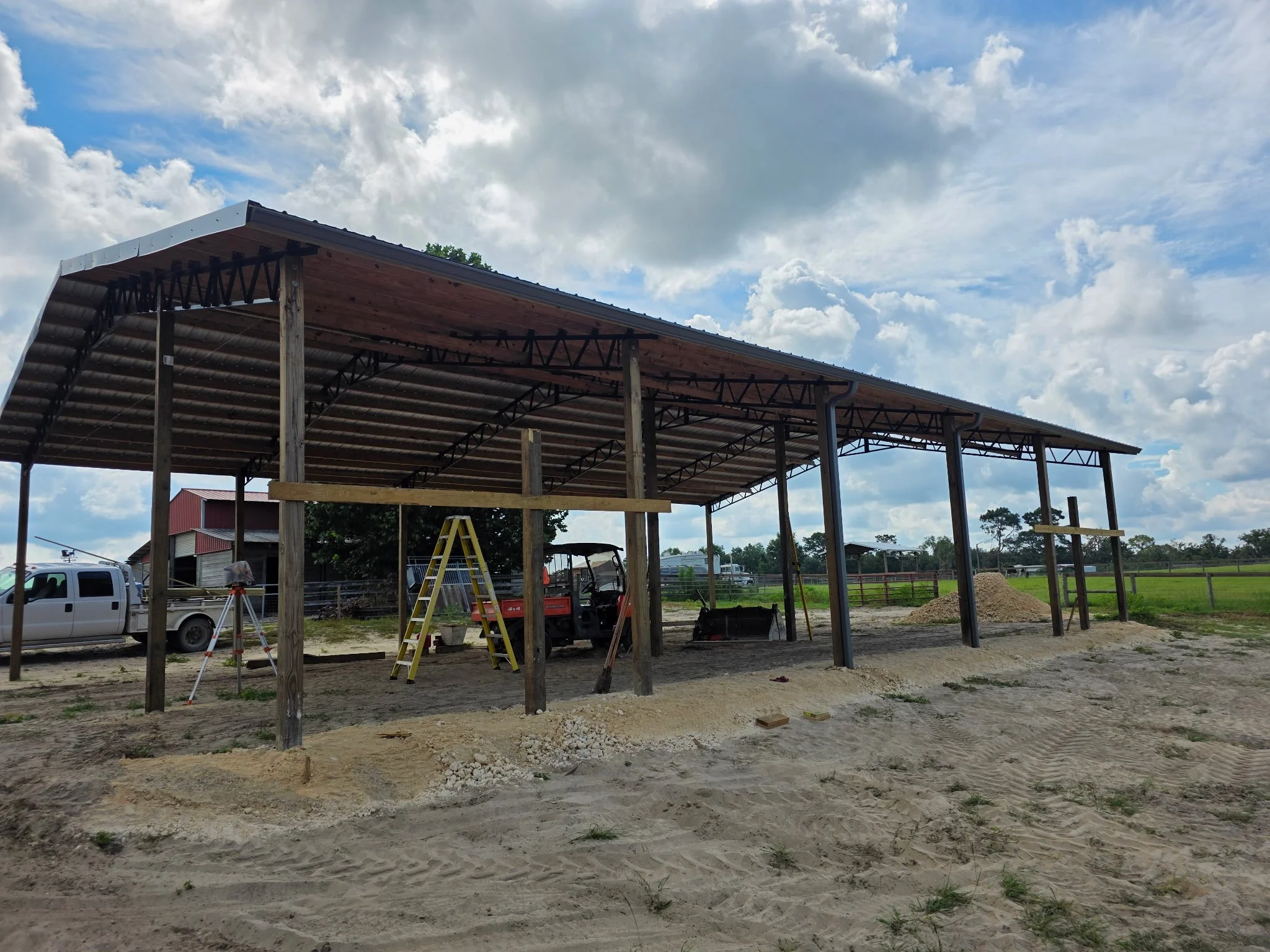 Charcoal Gray seamless gutters installed on pole barn in Dunnellon, Florida
