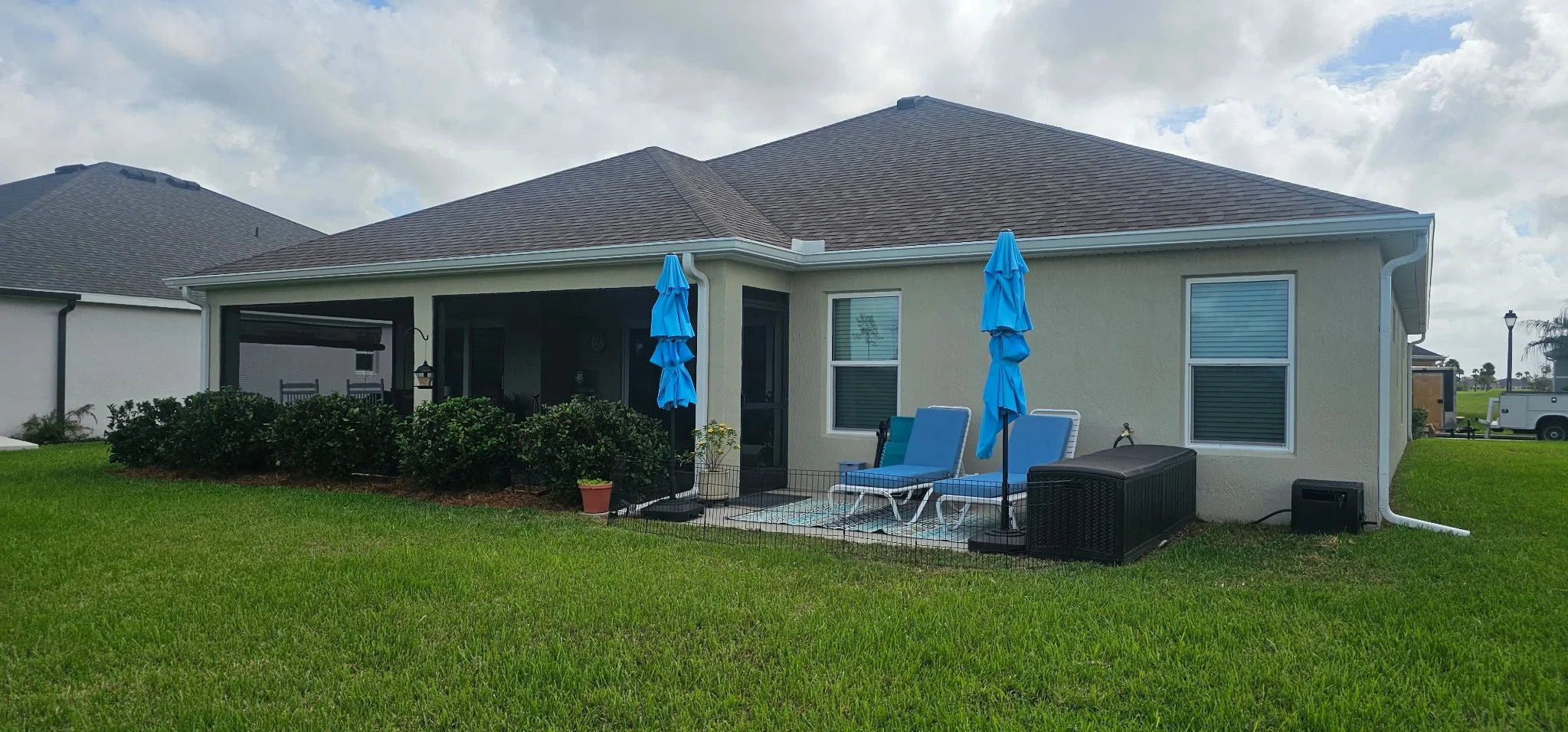 White seamless gutters and downspouts installed on home in The Villages, Florida