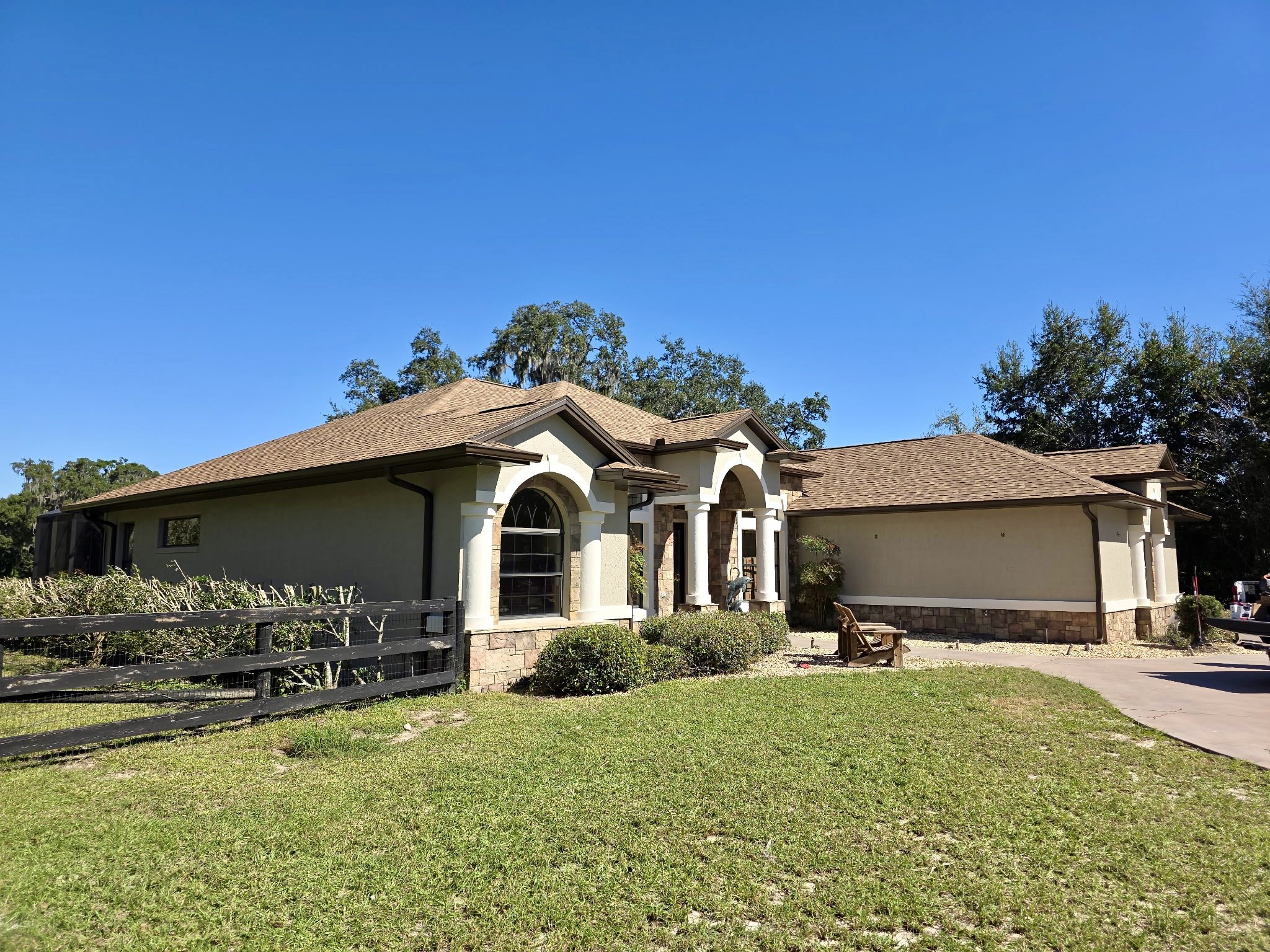 Musket Brown seamless gutters and downspouts installed on home in Wildwood, Florida