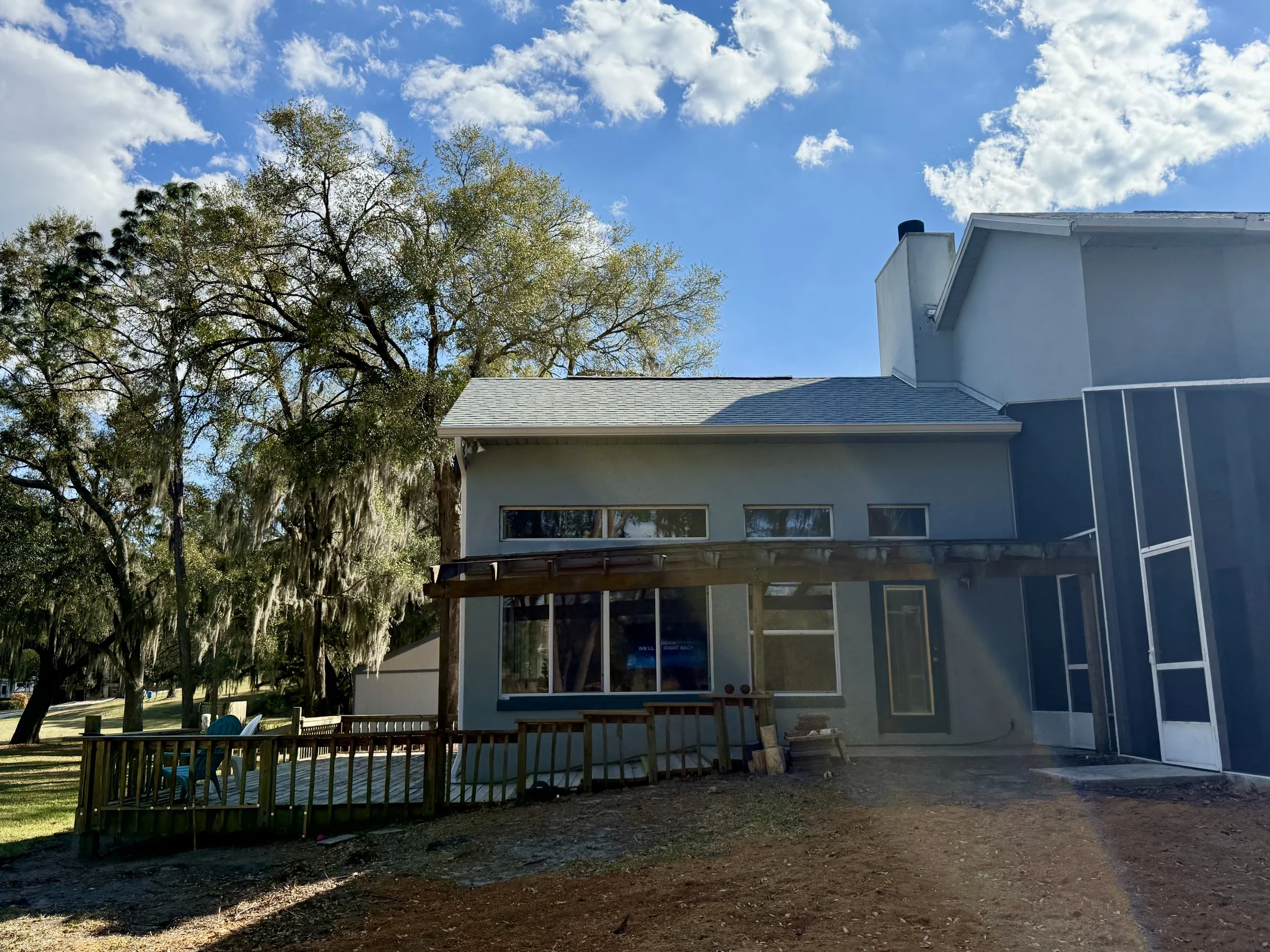 Rear view of waterfront home with white seamless gutters in Sunset Pond, Mount Dora, Florida