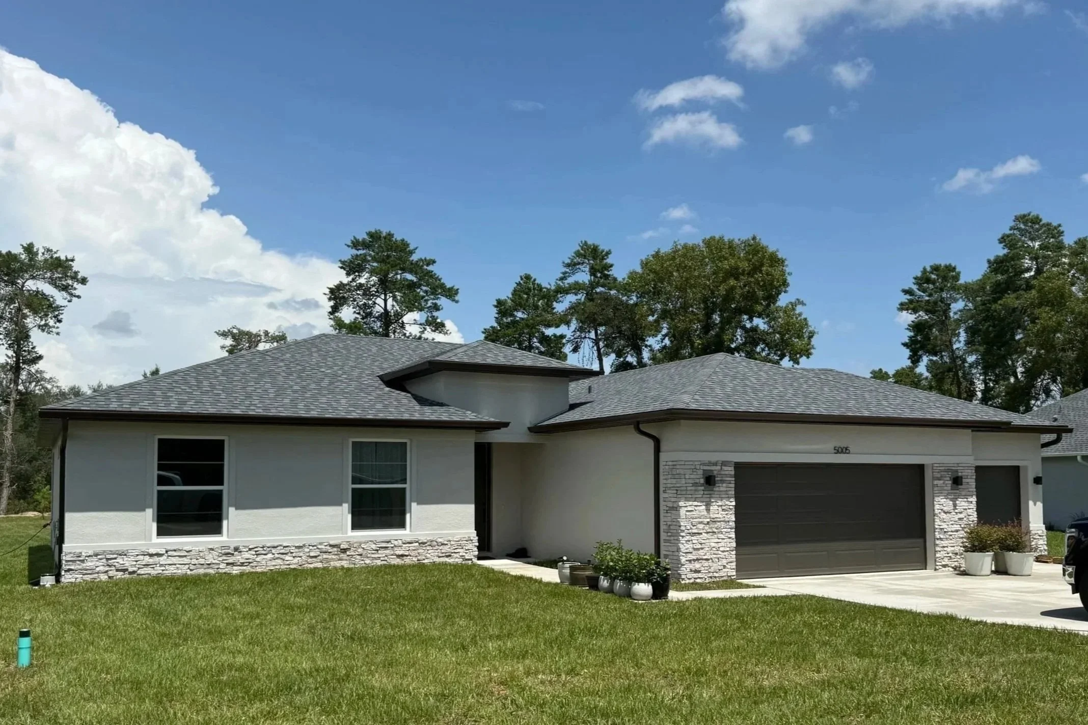 Royal brown seamless gutters installed on a home in Citrus Springs, Florida.