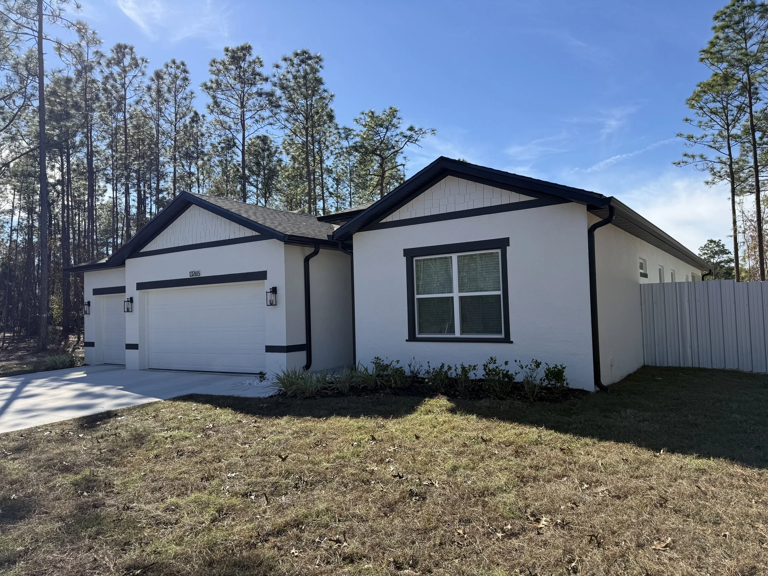 Black seamless gutters installed on home in Marion Oaks, Florida