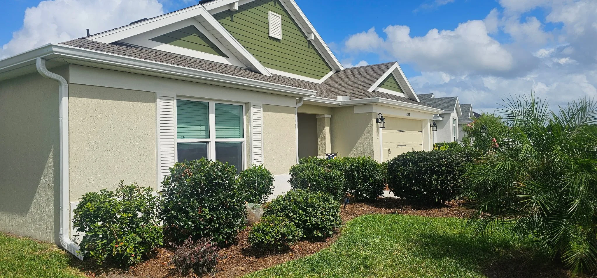 White seamless gutters and downspouts installed on home in The Villages, Florida