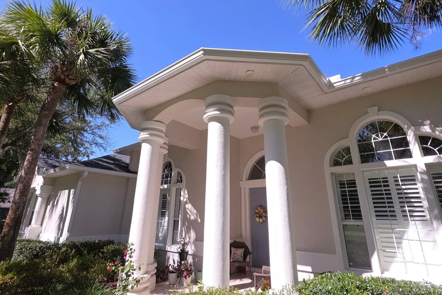 White seamless gutters installed on a home in the Country Club of Ocala in Ocala, Florida.