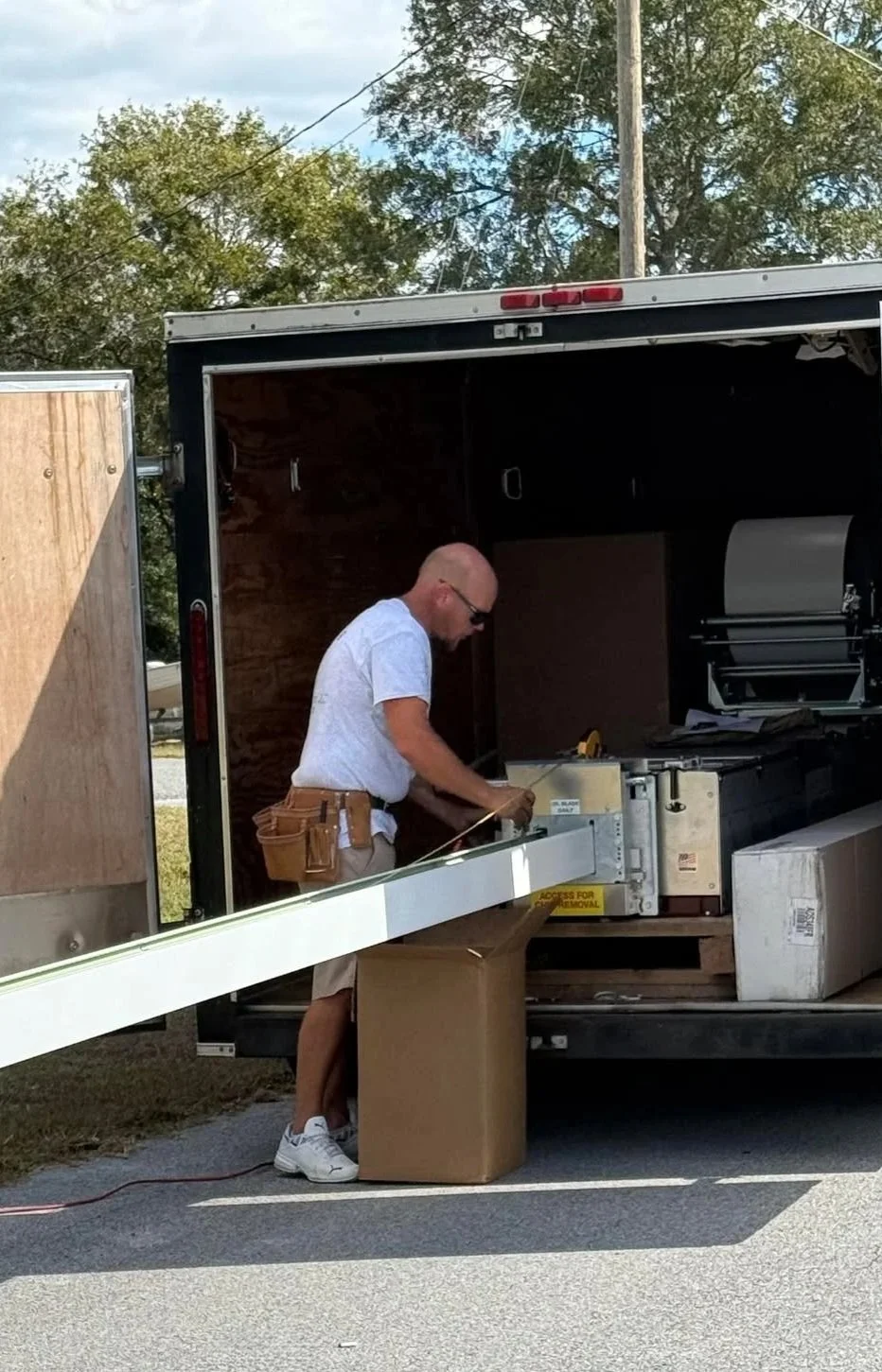 Danny forming seamless gutters on-site for a custom gutter installation