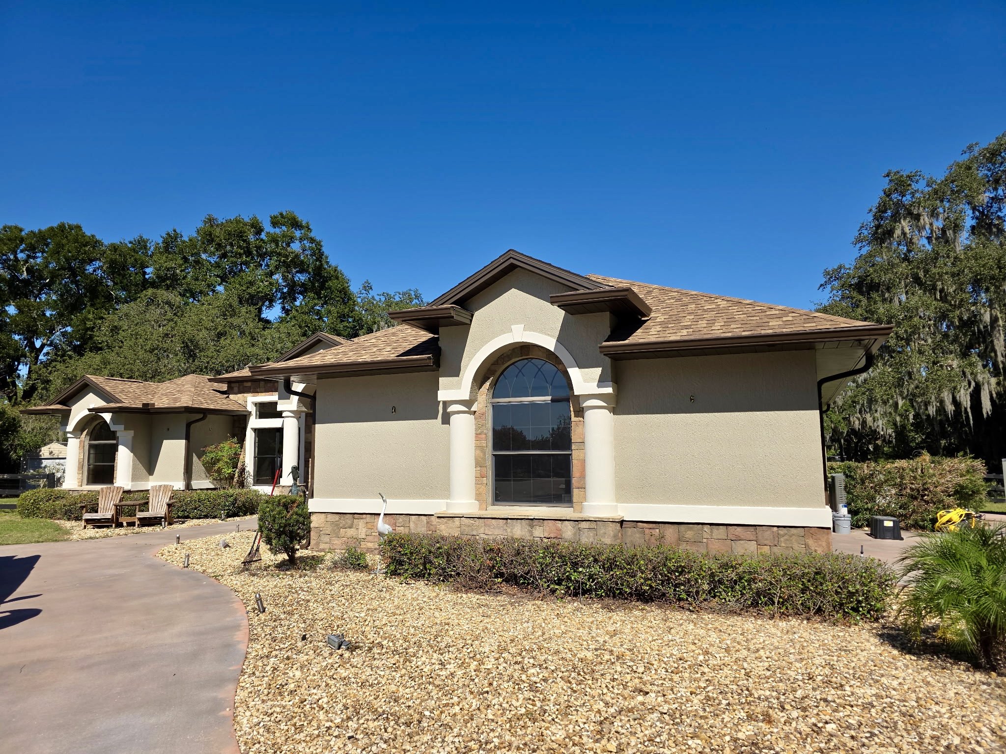 Musket Brown seamless gutters and downspouts installed on home in Wildwood, Florida