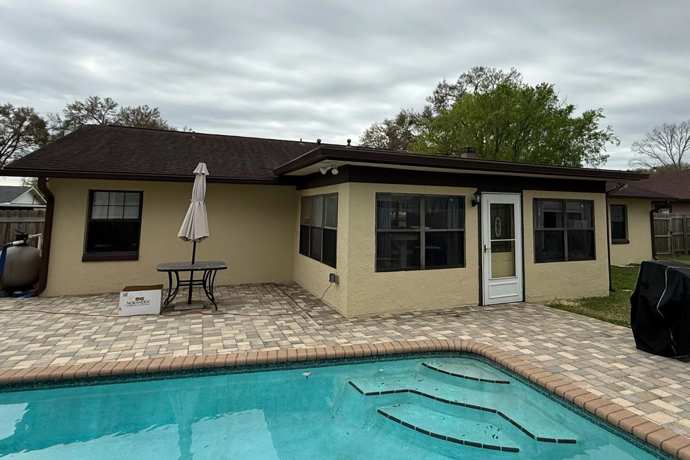 Royal brown seamless gutters installed after removing old leaking gutters from an Ocala, Florida home.