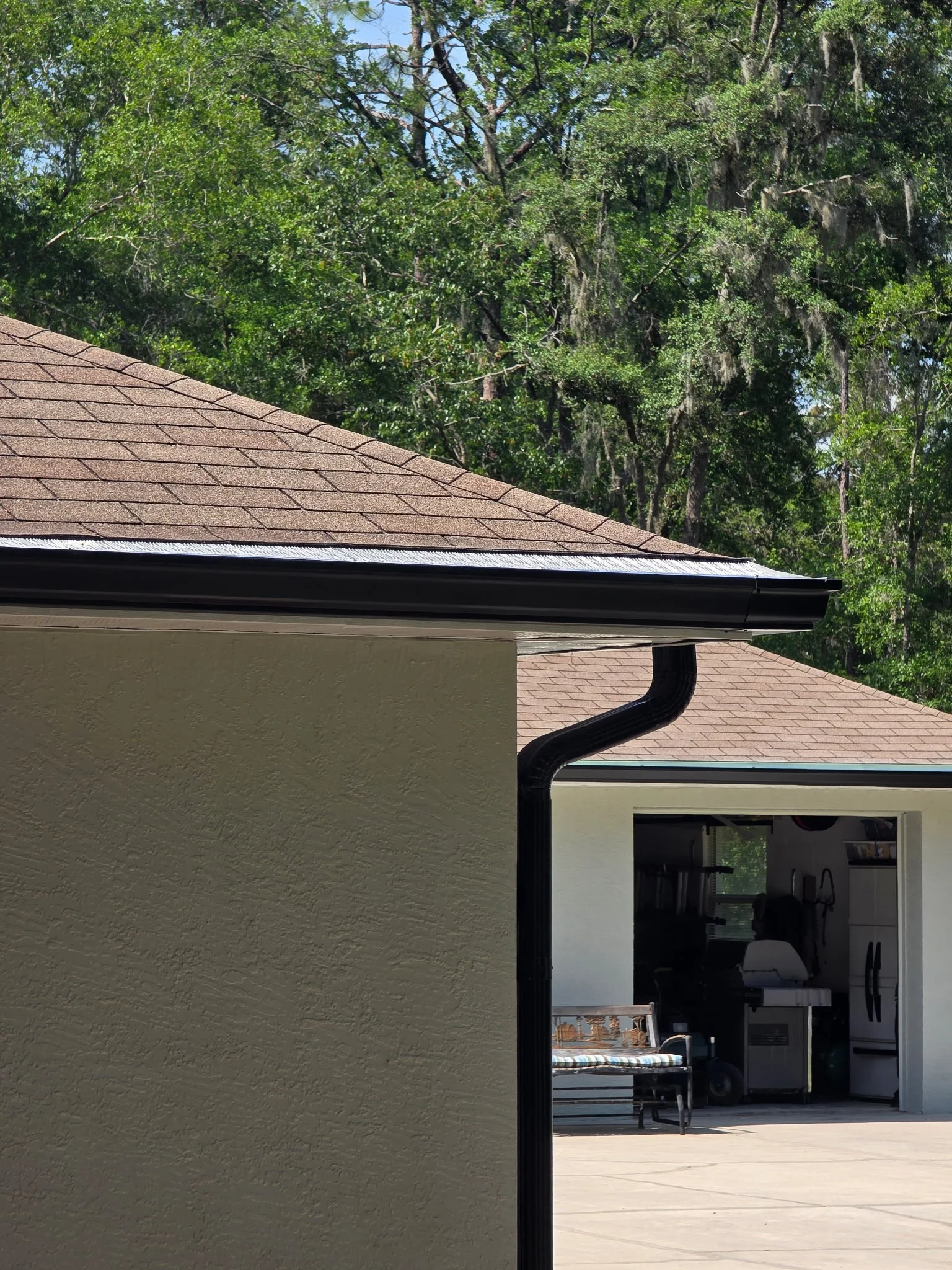 Dark Bronze seamless gutter and downspout installed on Dunnellon home