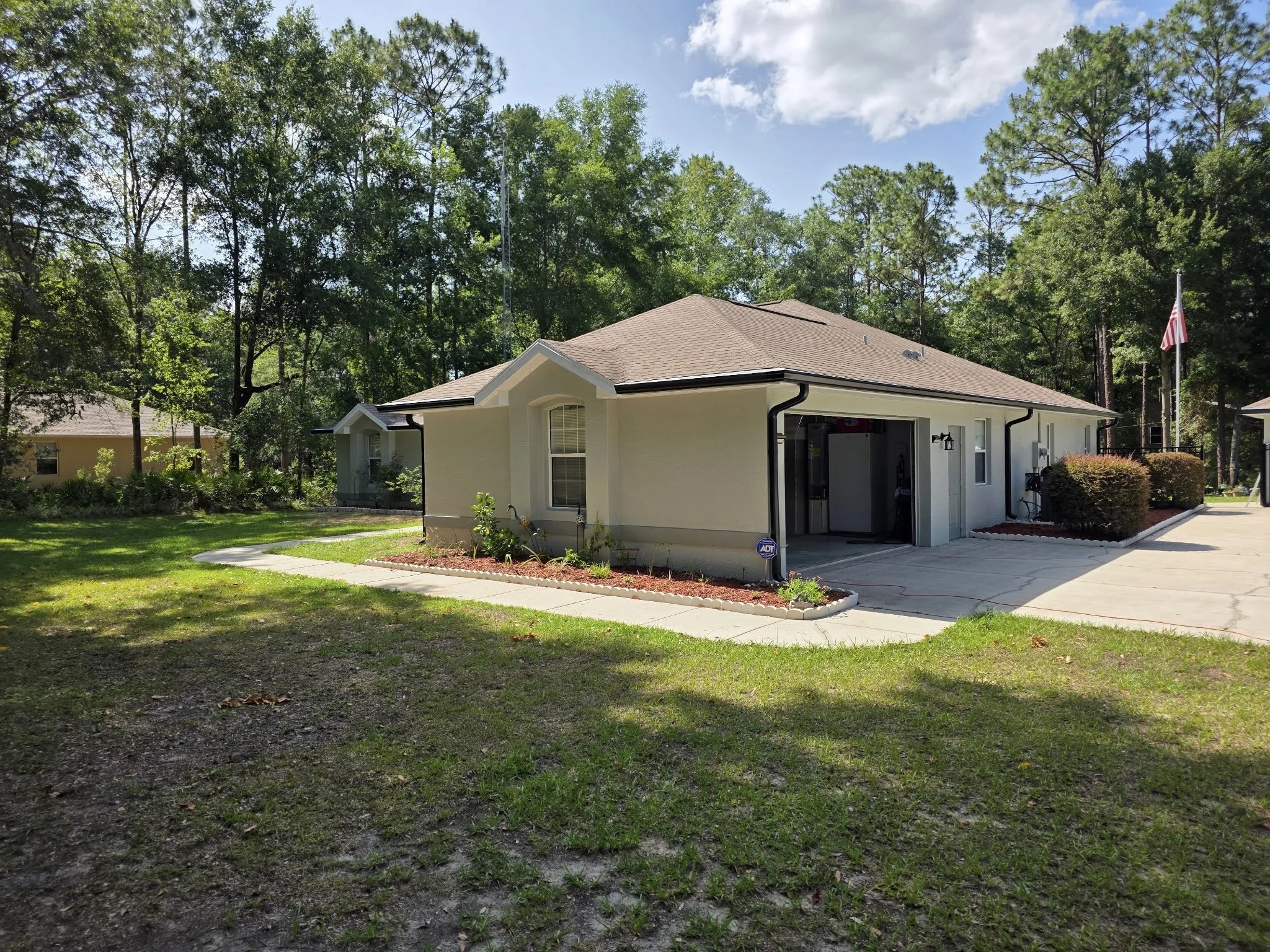 Dark Bronze seamless gutters and downspouts installed on home in Rolling Hills, Dunnellon, Florida