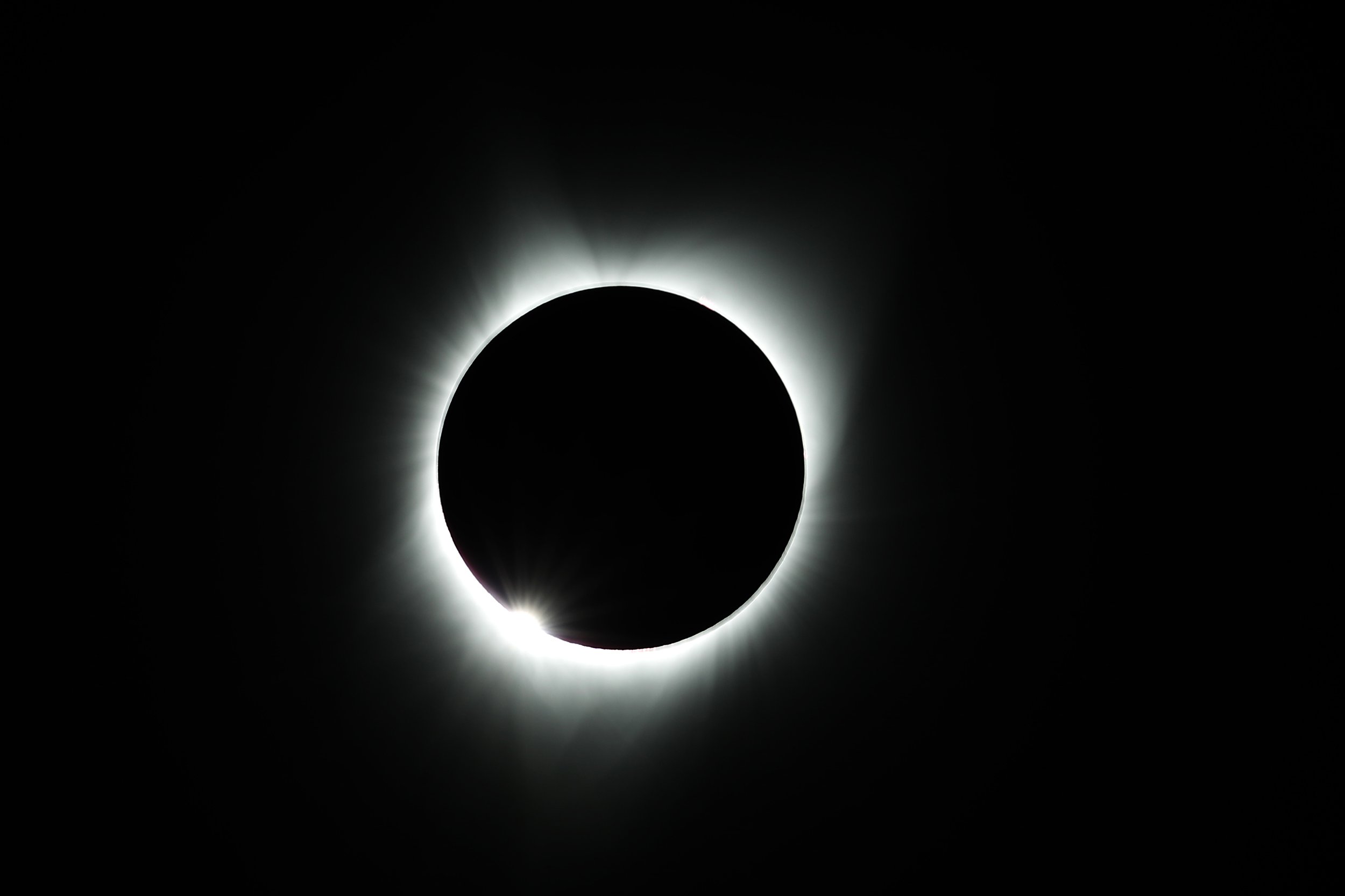 A total solar eclipse with a visible corona as part of a photography workshop.
