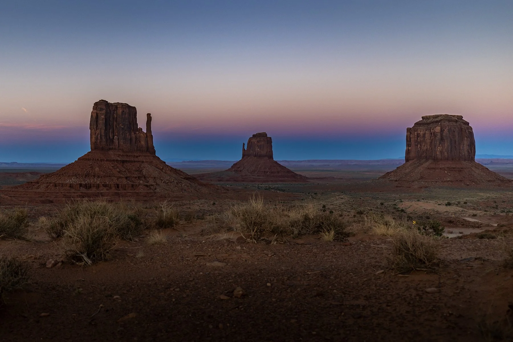 The West and East Mitten in Monument Valley at sunset.