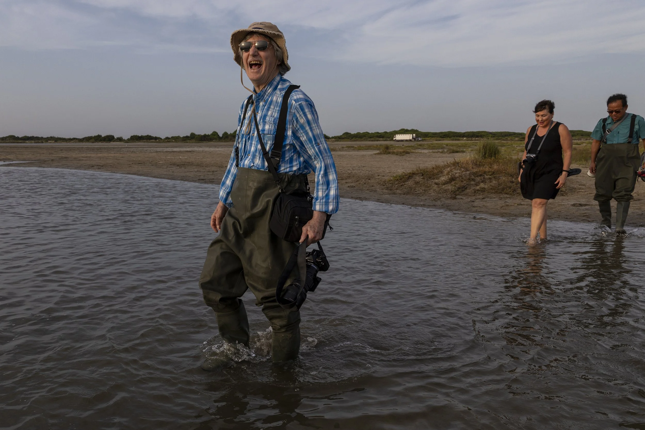 A workshop participant takes in a peaceful moment amid the landscapes of the Camargue, France, during the photography adventure.