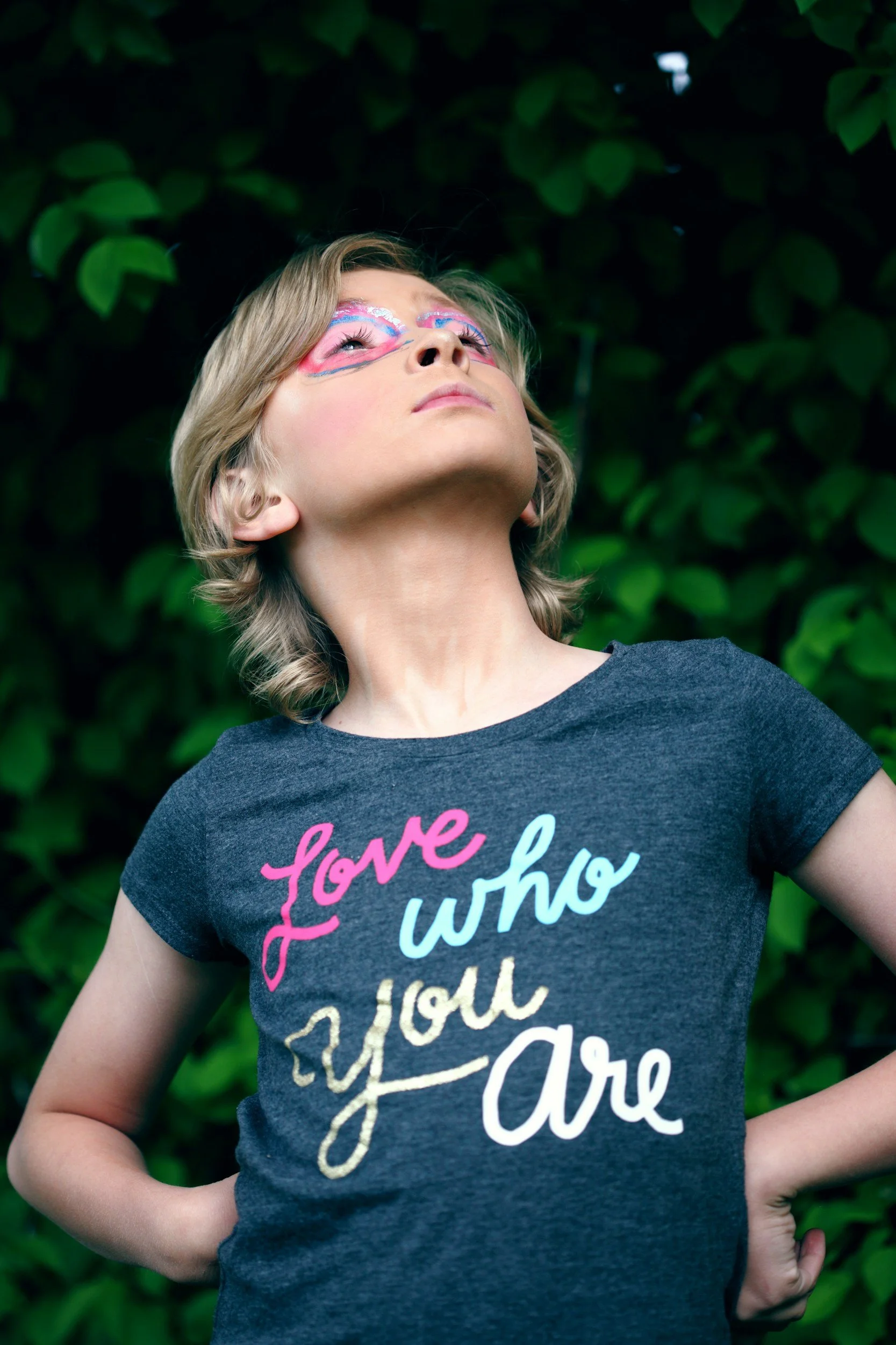 a person flaunting their love who you are shirt