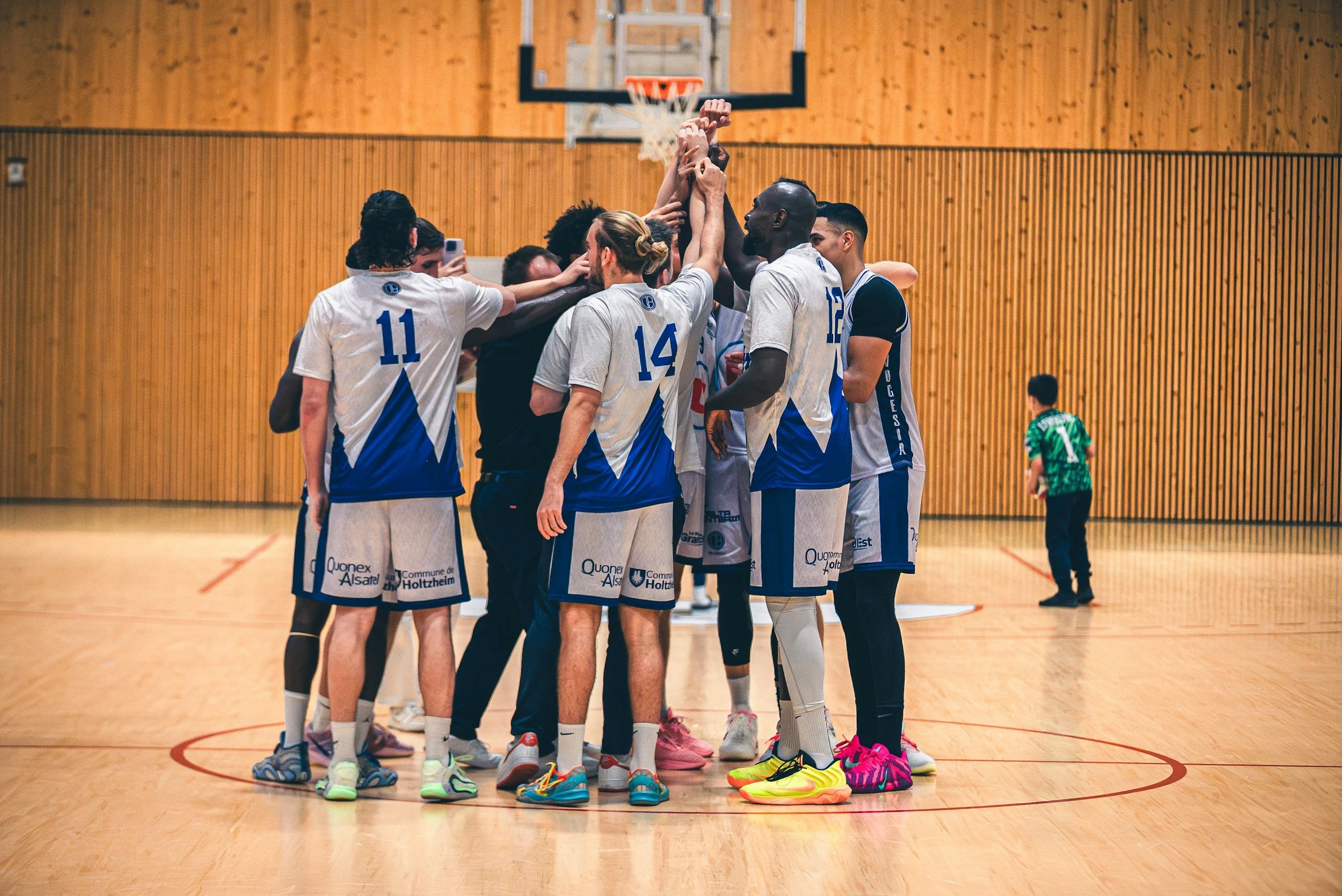 a basketball team in a huddle