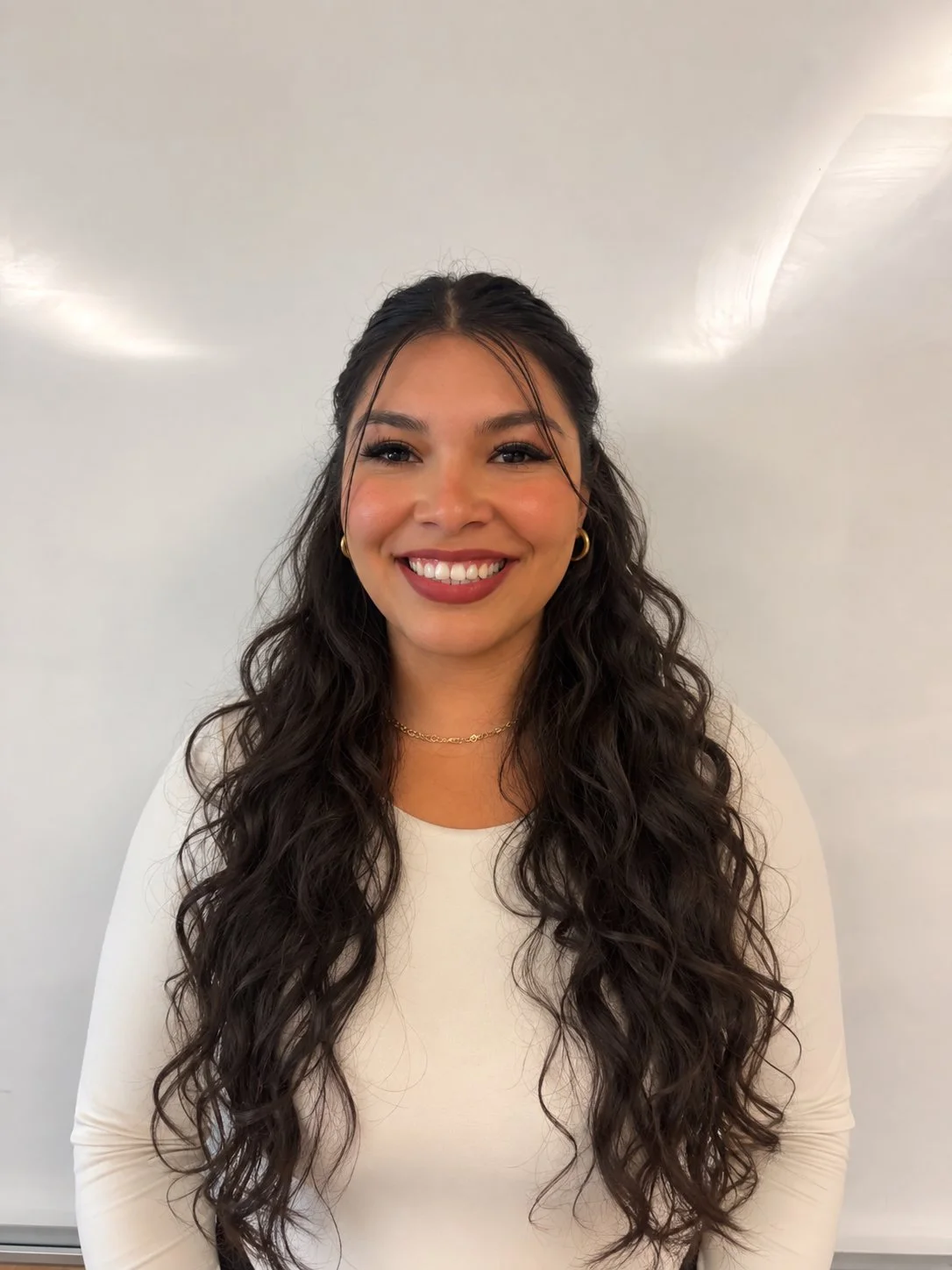 an image of Mayra Gonzalez smiling a the camera