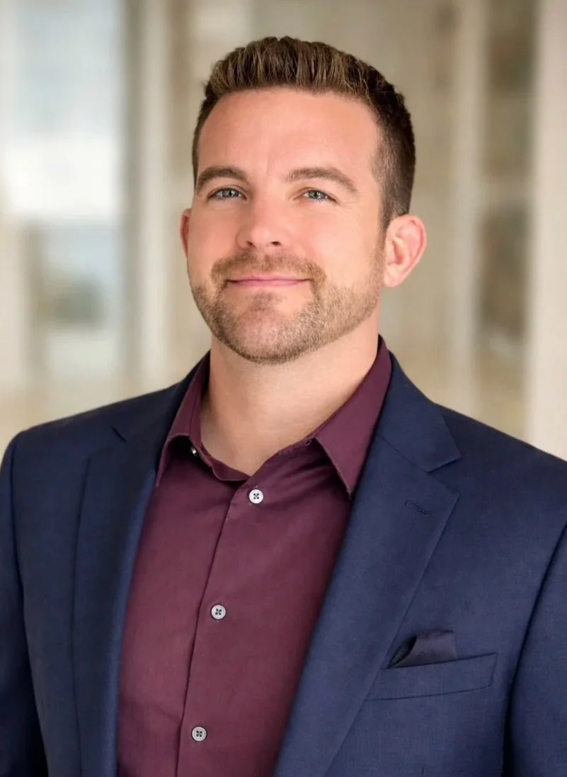 an image of Greg Rigali smiling at the camera