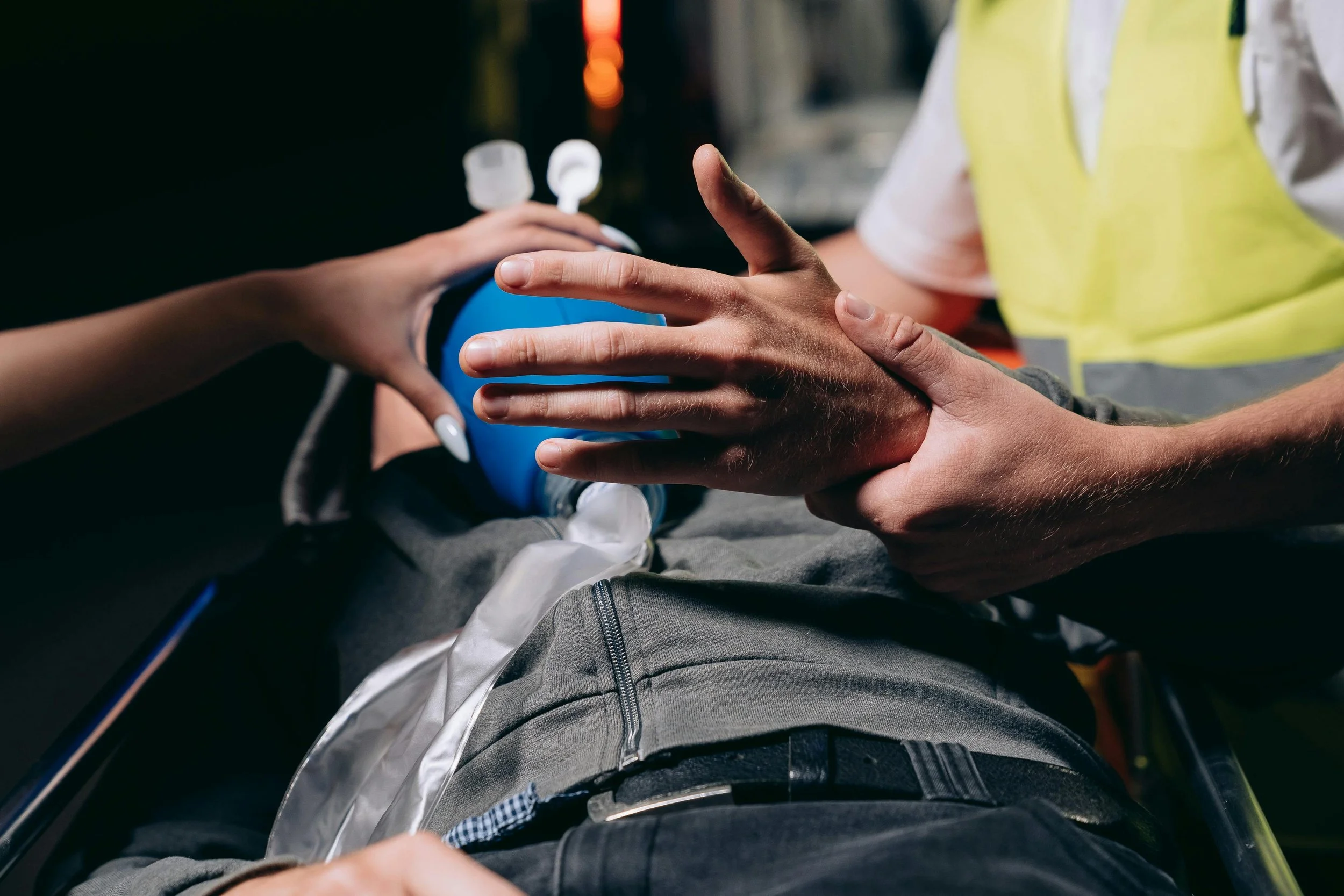 a person being helped by EMTs