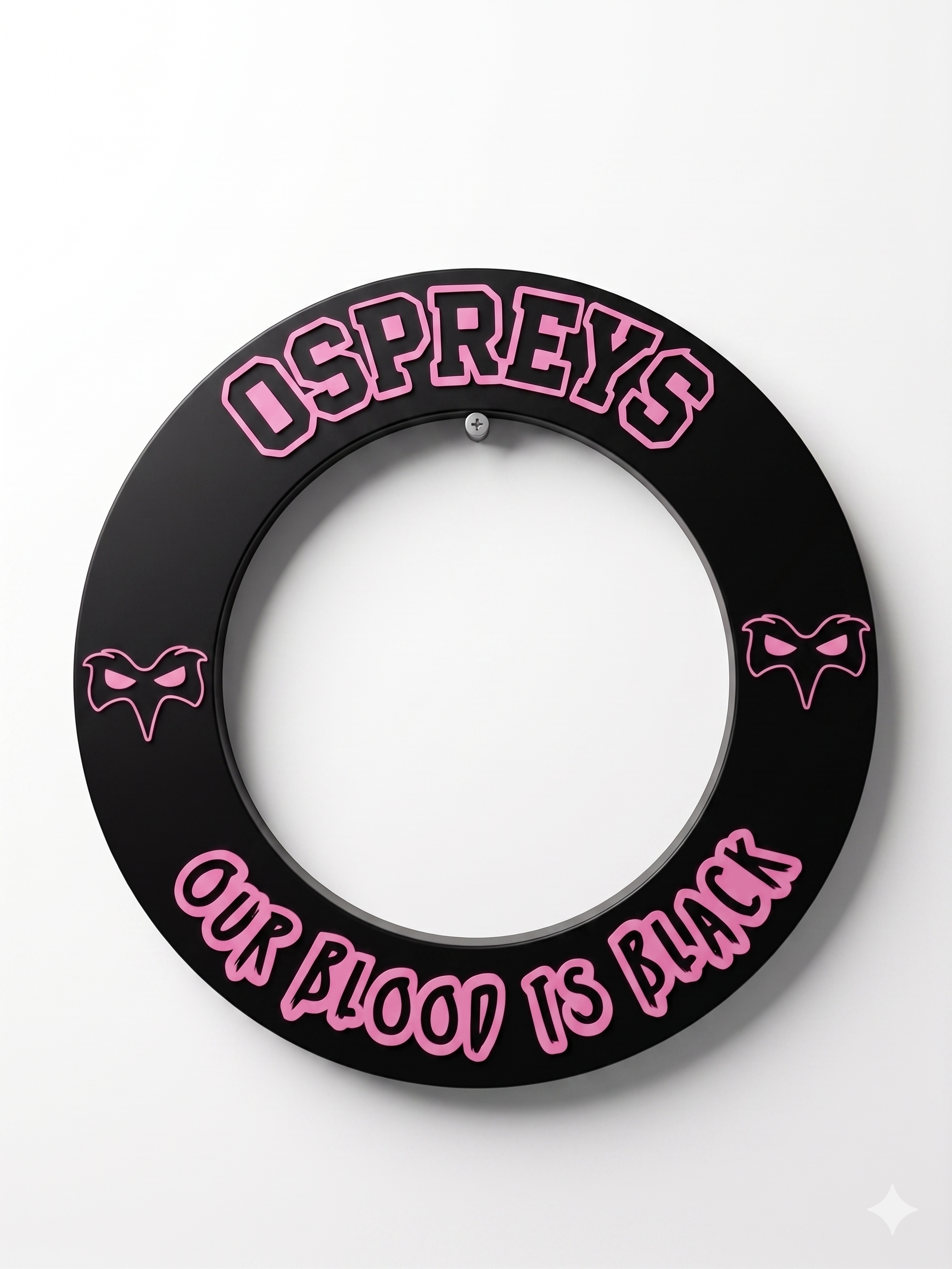 Decorative black circular sign with pink letter outlines reading 'OUR BLOOD IS BLACK' and 'DISPREY.' The sign features three stylized pink bat icons on a white background.