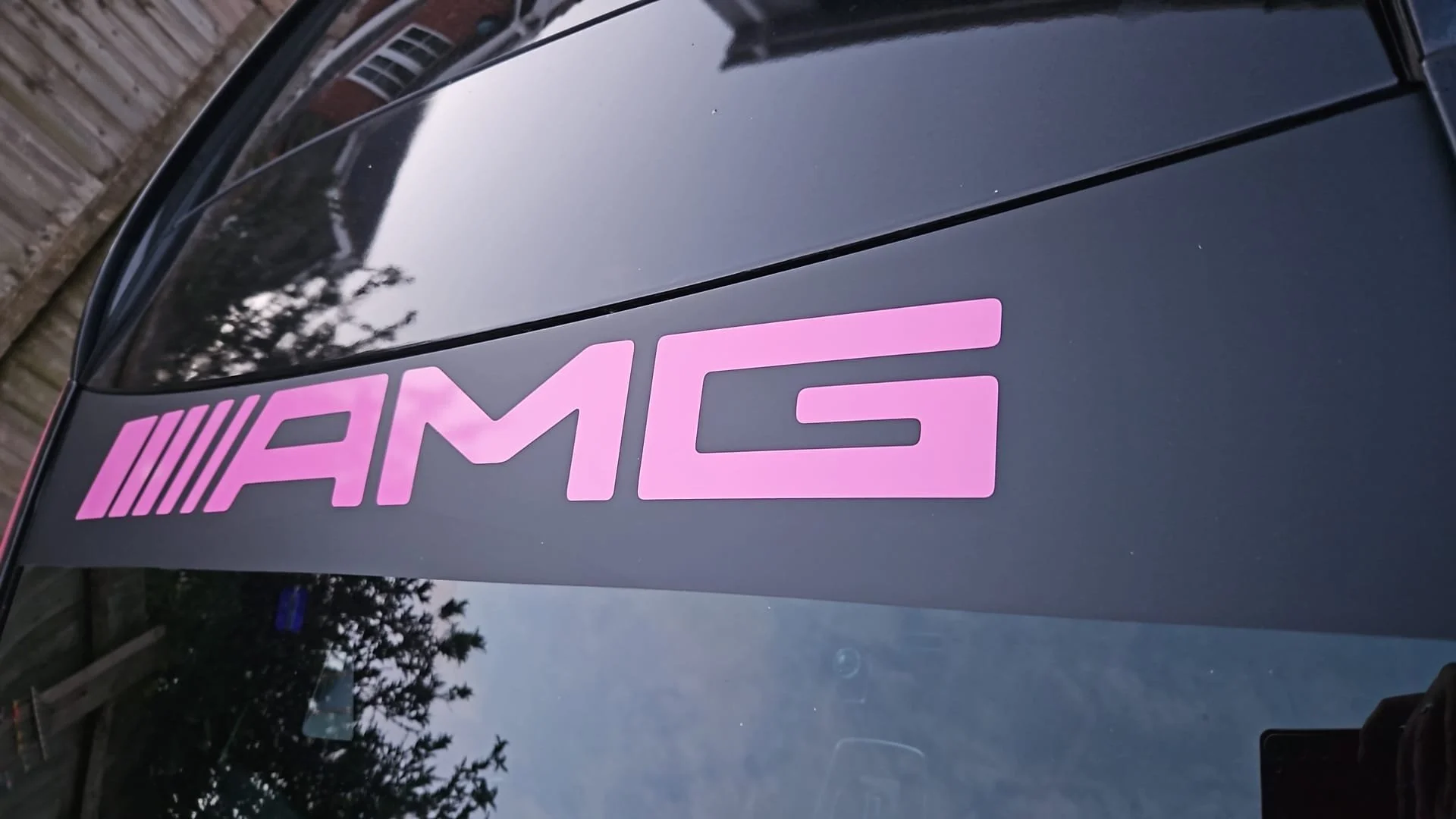 A black car with a pink