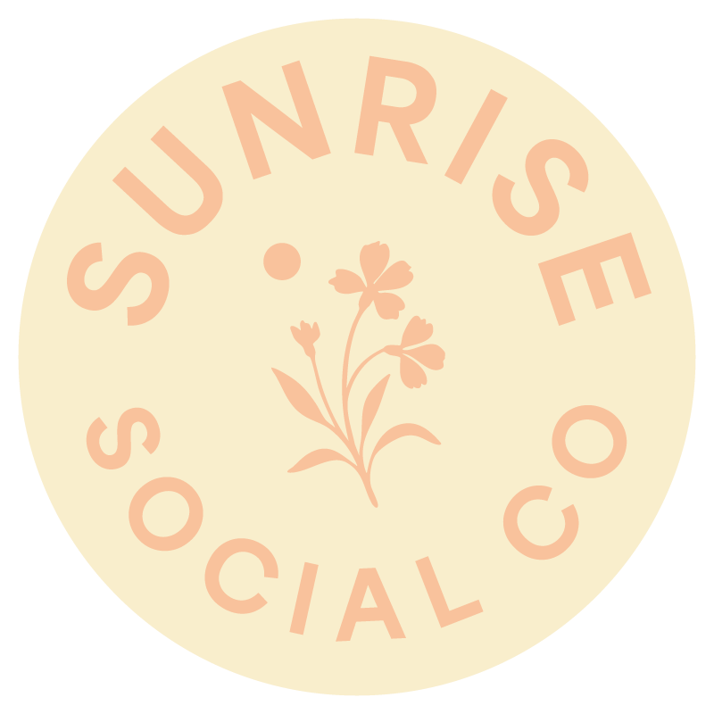 A logo for Sunrise Social Co. It's a light yellow circle with a peach colored flower in the center.