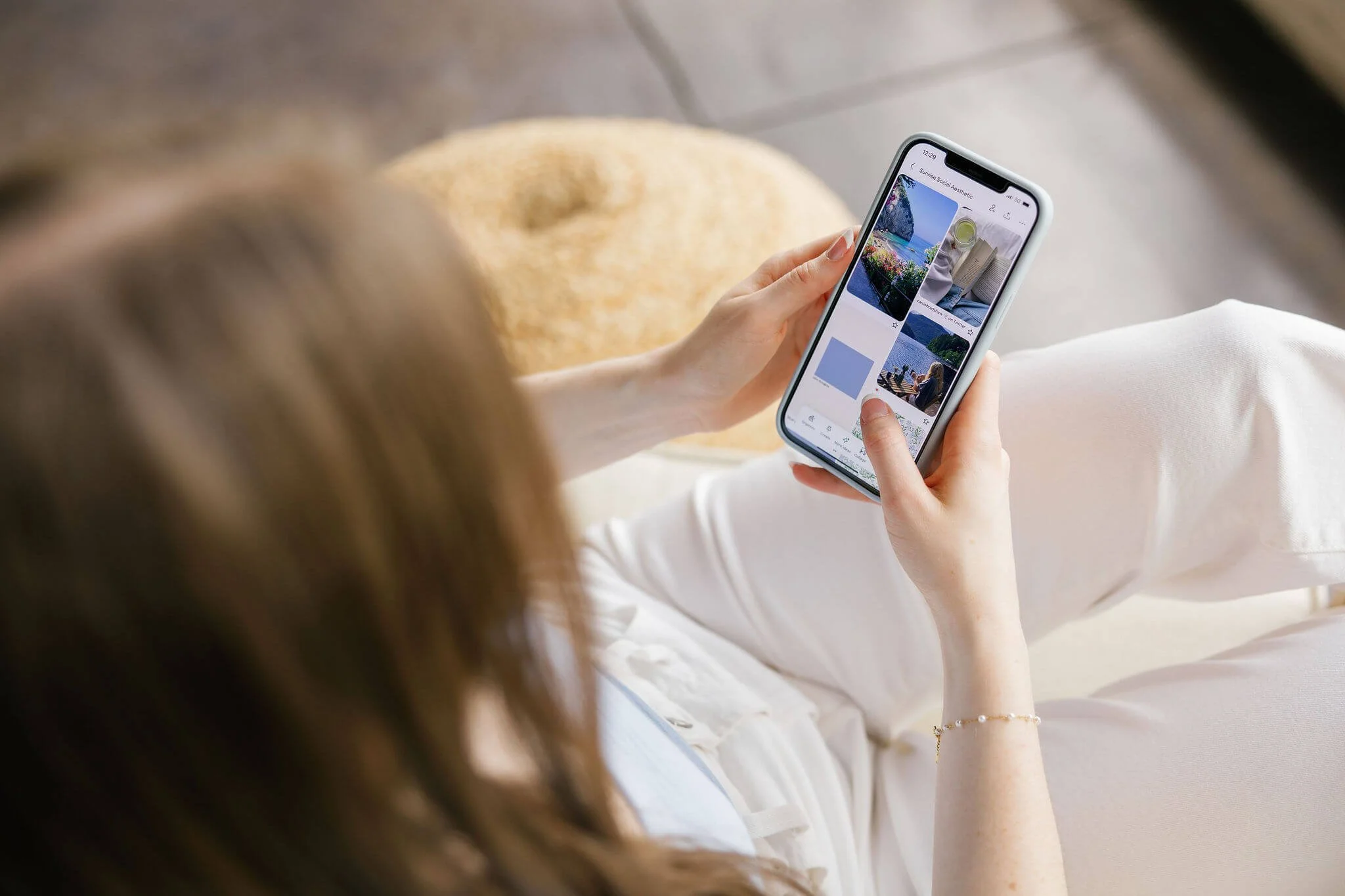 A Pinterest manager scrolling through Pinterest on an iPhone.