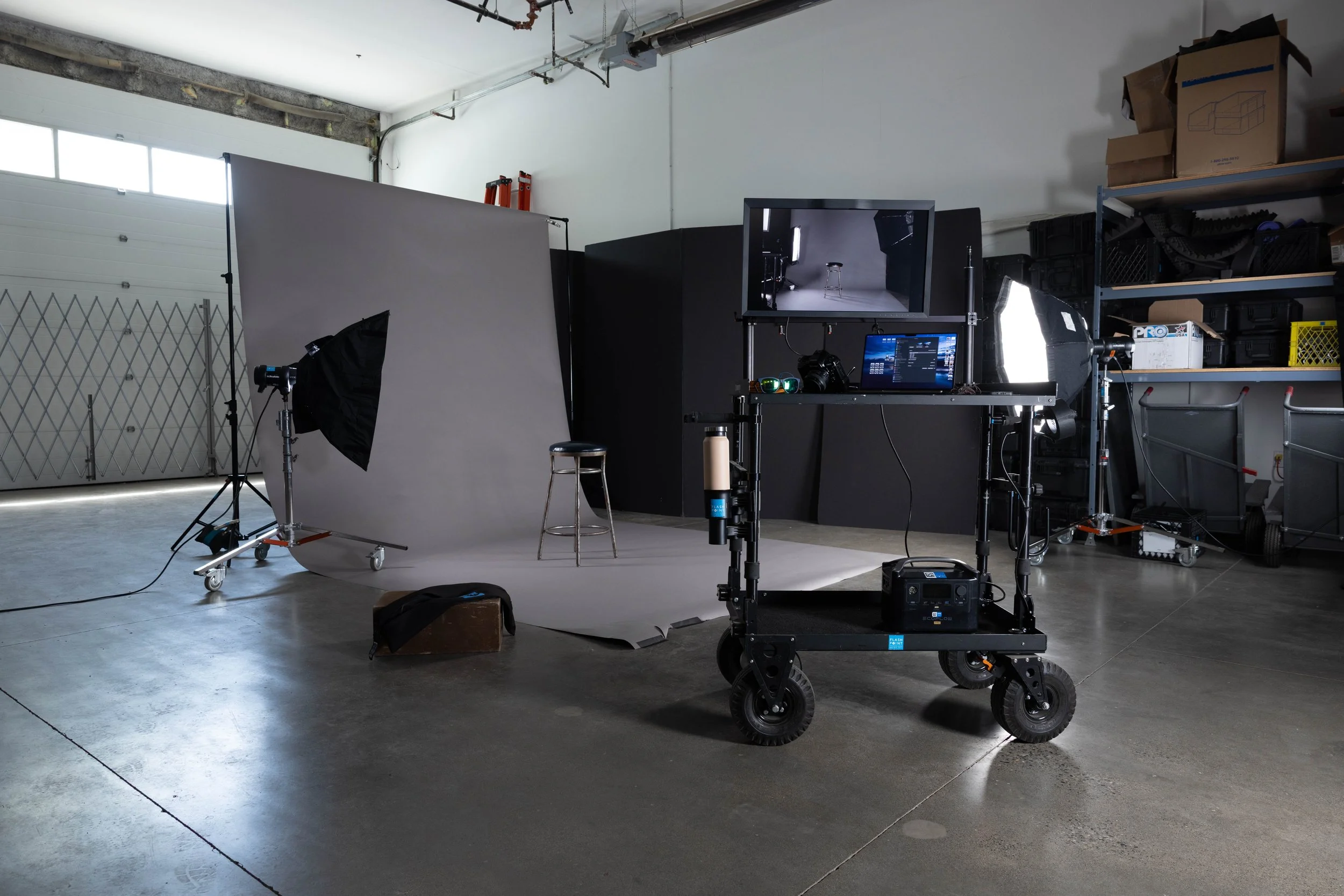 Grey backdrop on a photography set with and innovativ Cart macbook pro profoto d1 flashpoint Photographic rentals