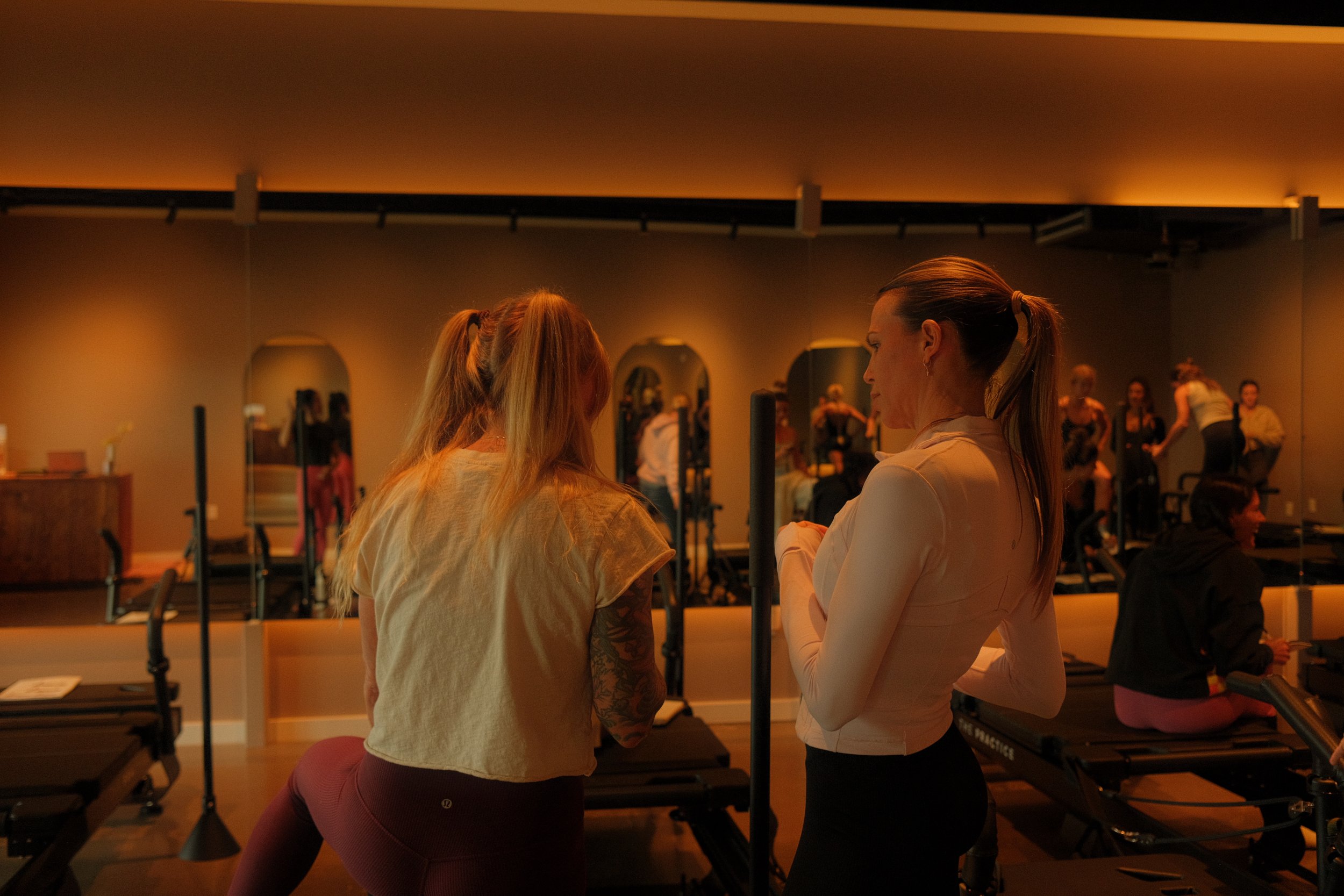 Instructor demonstrating proper form on the XFormer machine.