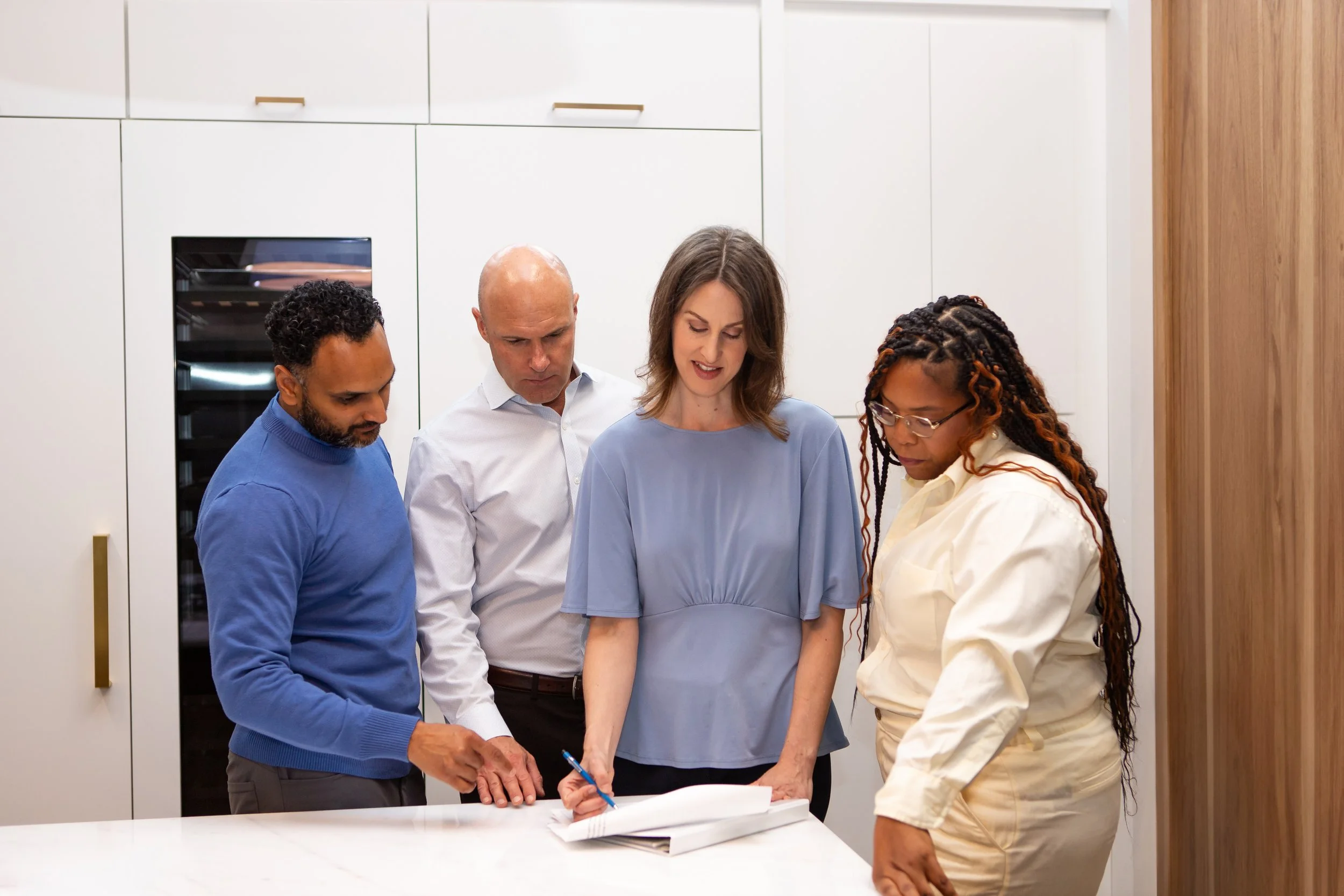 Catherine Meyer reviewing strategy documents with Austin-based service providers during a strategic partnership consulting session