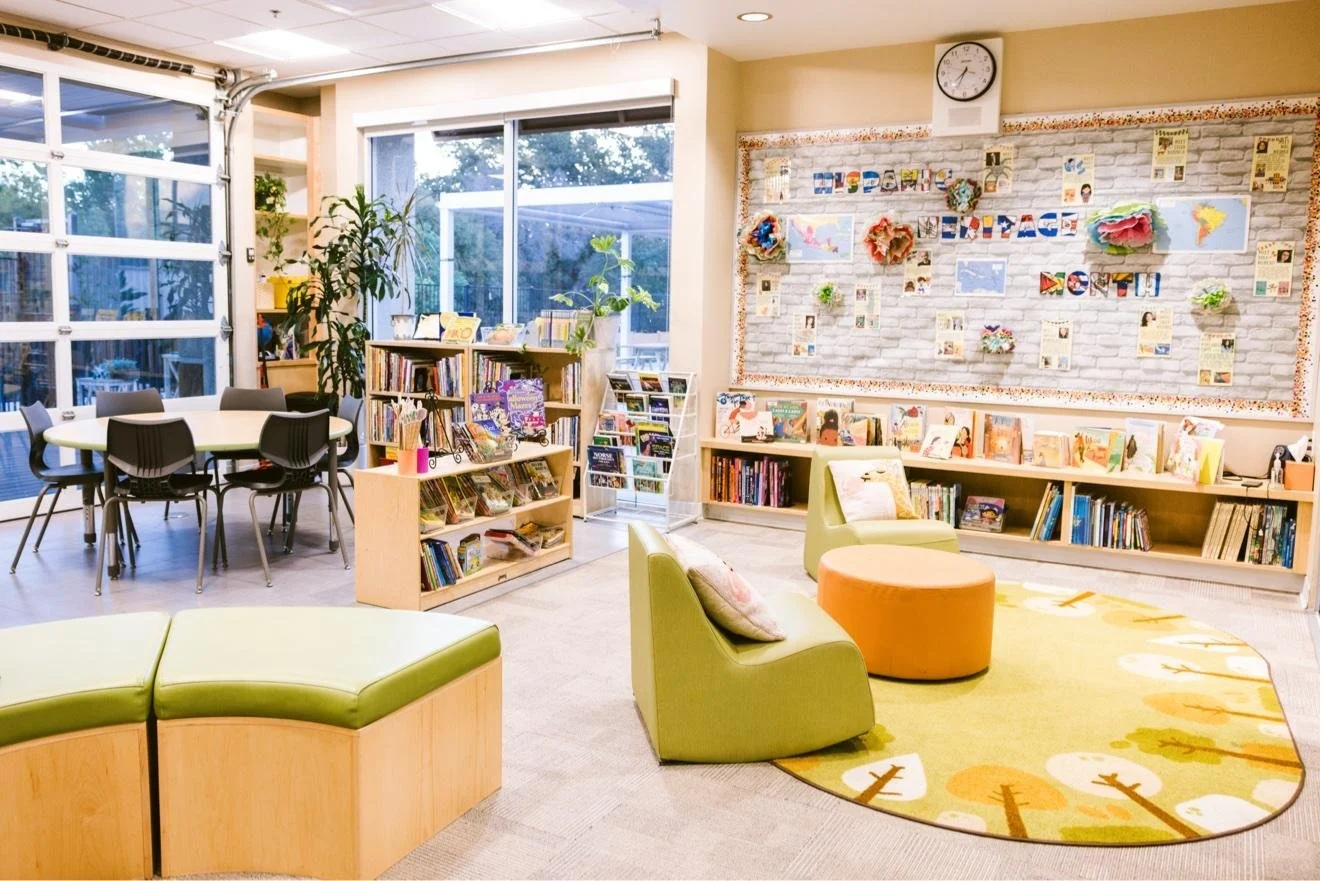 School library with low bookshelves and cushioned bench seats