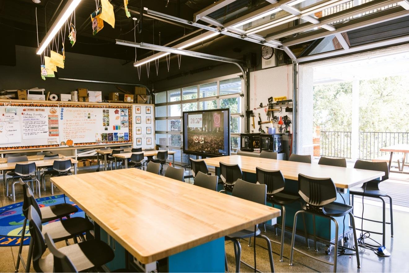 California International School maker space with wood workbench tables