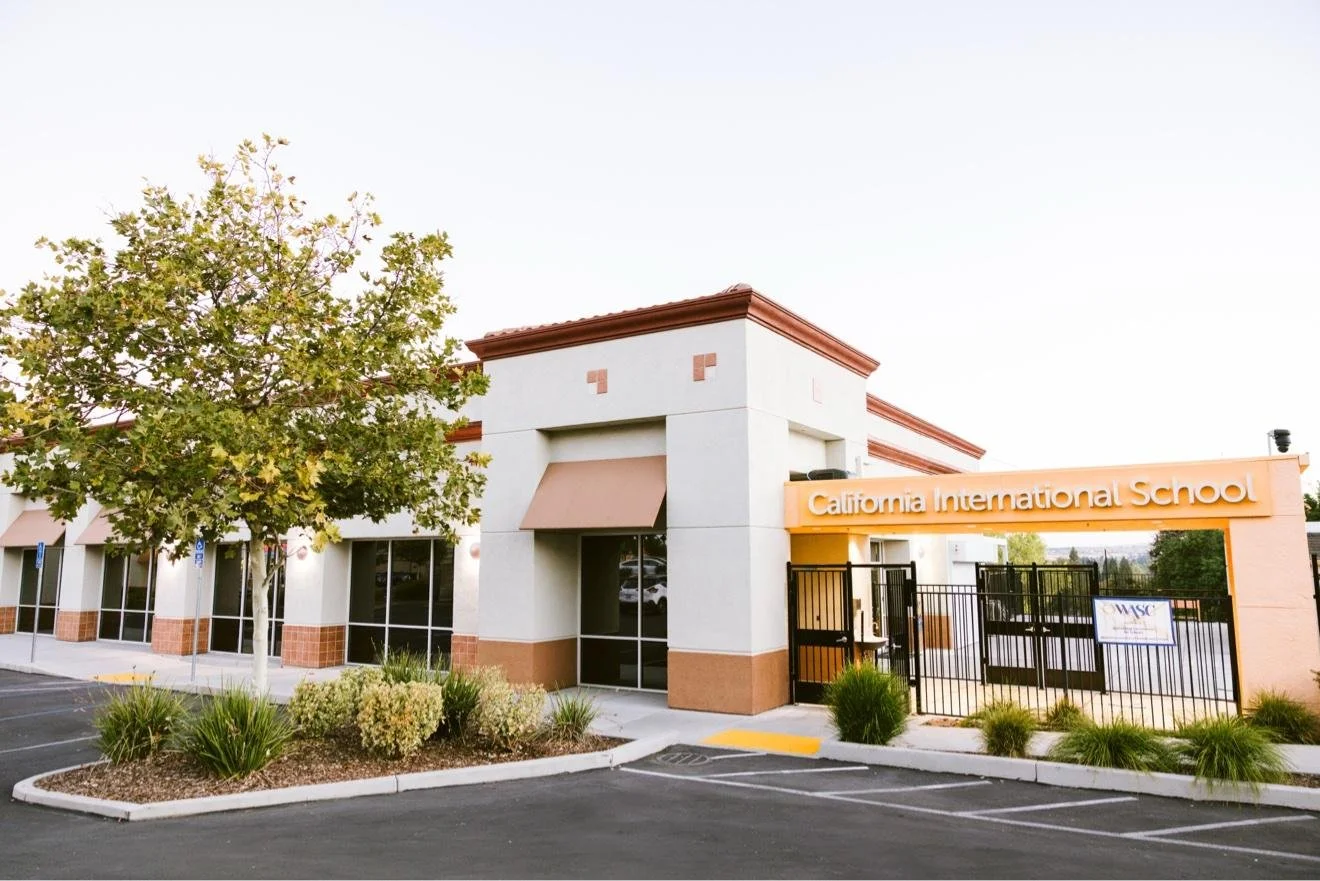 California International School building entrance and parking lot