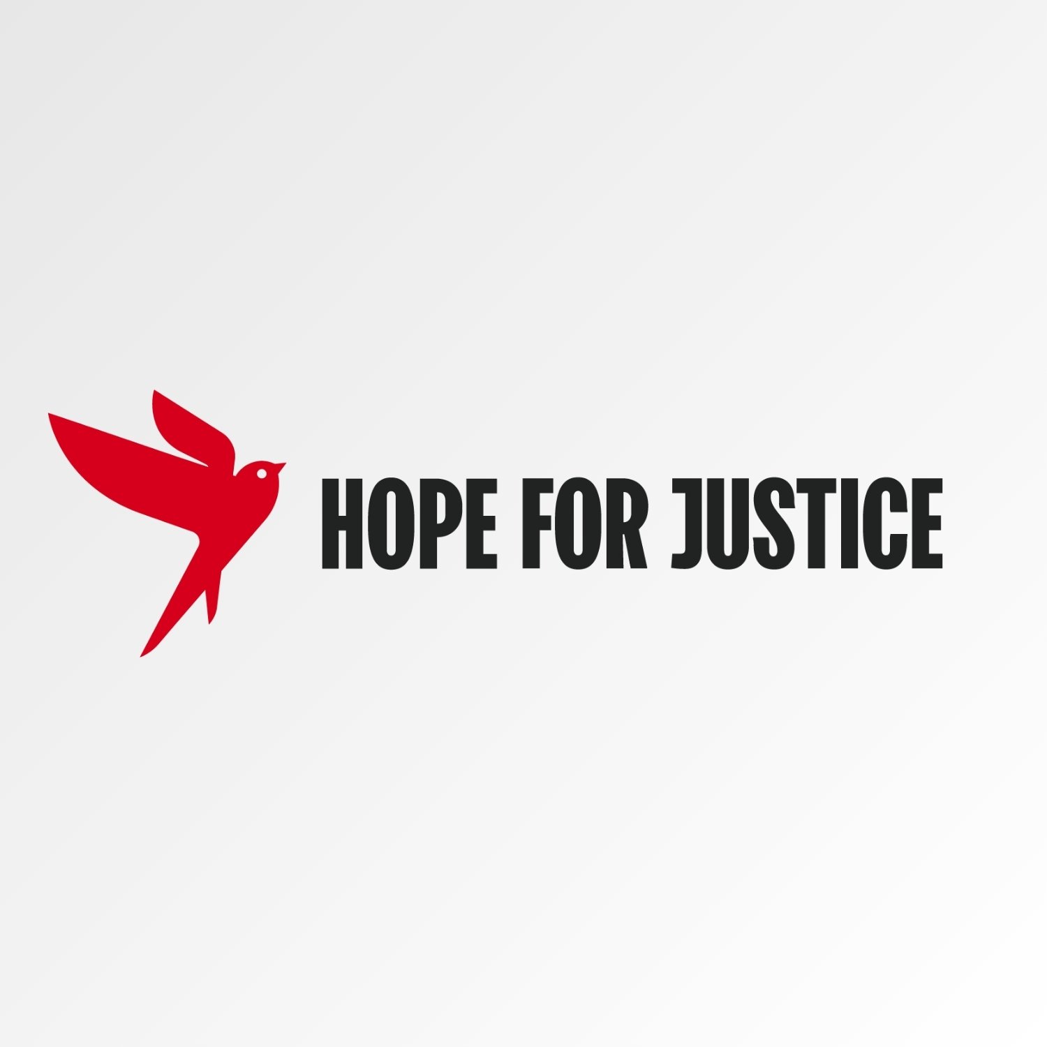 Red dove with a black eye, and the text "Hope for Justice" in black letters.