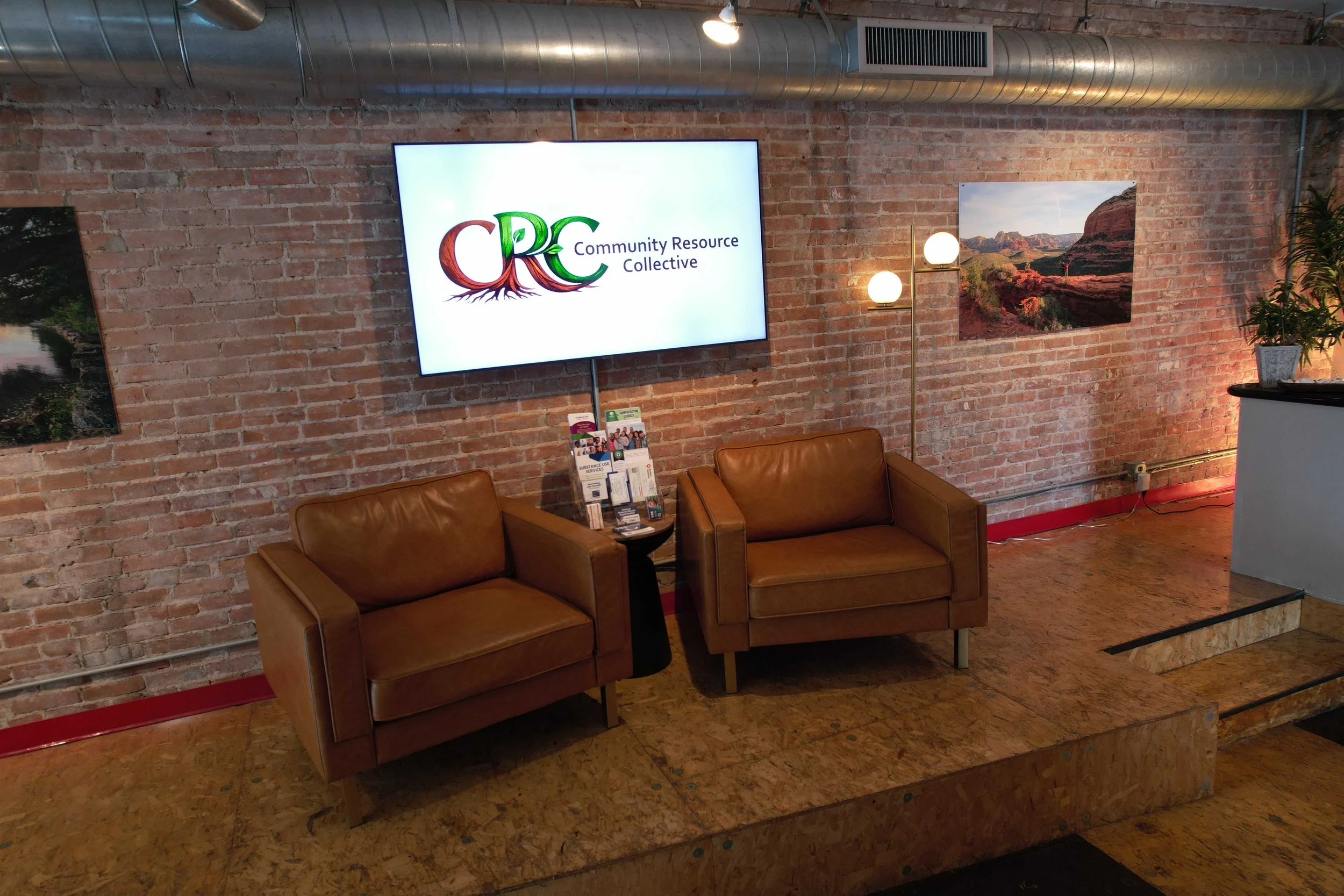 Waiting area with program information from Community Resource Collective.