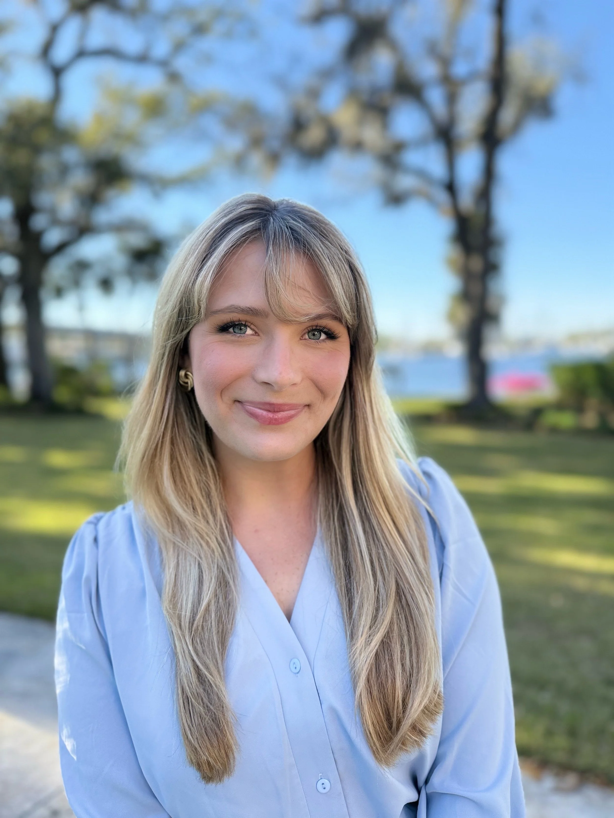 Young adult feeling empowered after therapy with Kaycee Kinnard, LCSW in Jacksonville, Florida