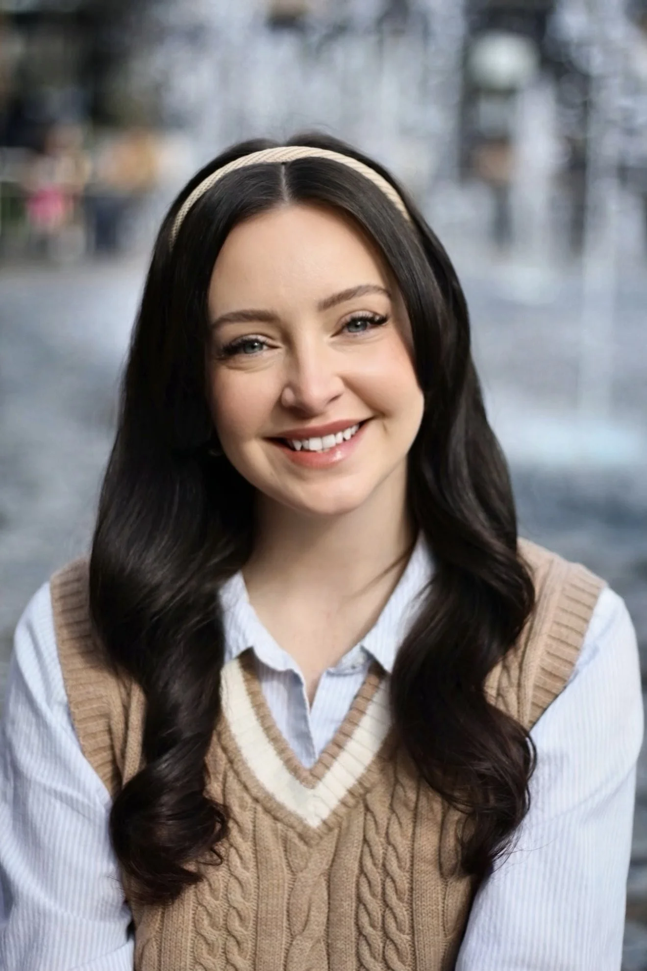 Headshot of woman with dark hair smiling