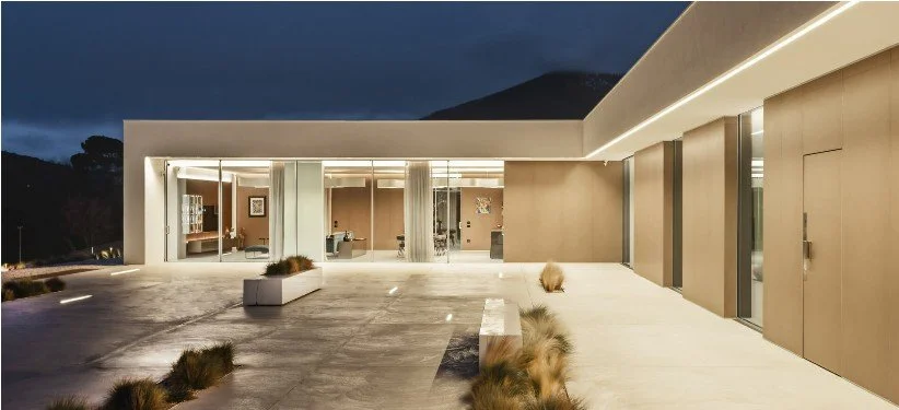 Empty white park bench on concrete ground