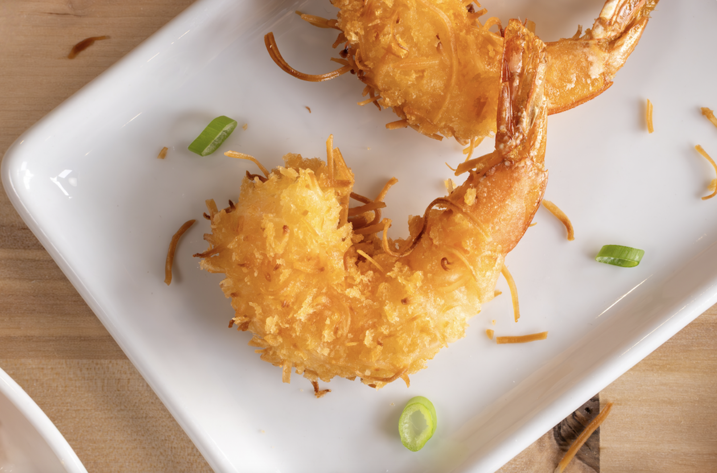 Upper Crust Enterprises Panko providing the ideal coating for Coconut Shrimp, a perfect menu addition for Commercial Seafood Distributors and restaurants