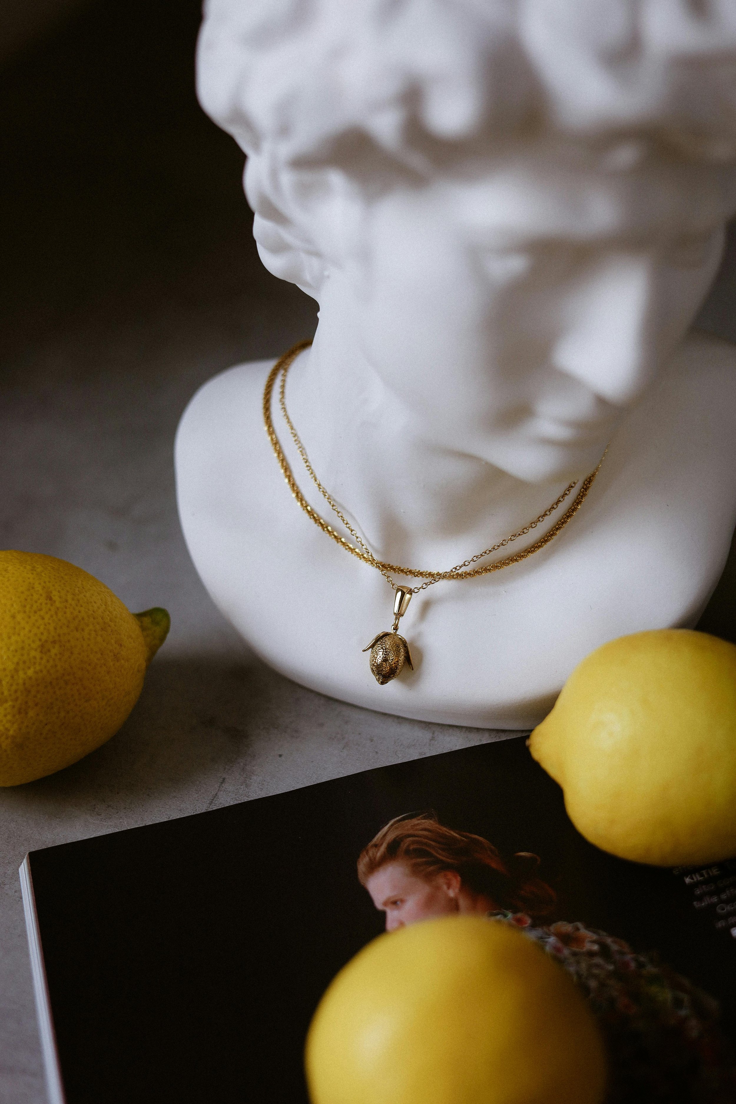 A classical bust paired with fruit, the Sensual register of the Instinct Aesthetic