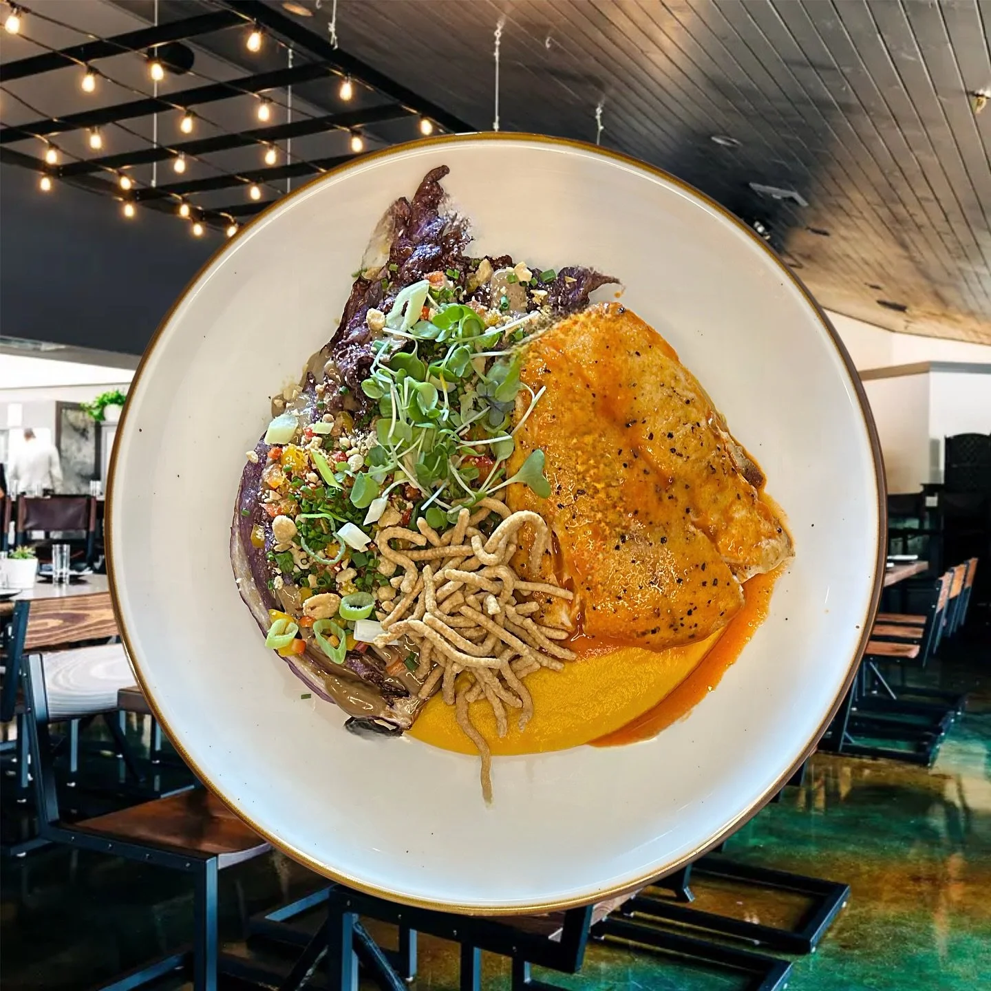 Happy Saturday! Come see us at the Oyster Bar and try our featured NC Red Snapper served with crispy purple cabbage, a swirl of black garlic aioli, a burst of diced peppers, green onions, and a velvety miso carrot puree. Finished off with crunchy pea
