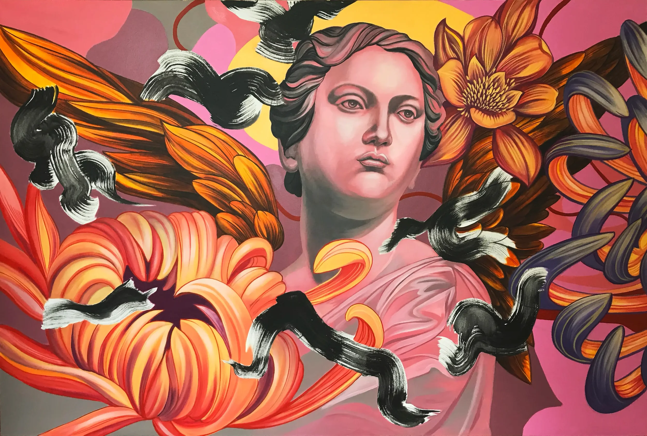 A colorful mural featuring a woman's face surrounded by blooming flowers and flowing black and white hair on a pink background.