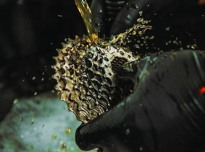 cleaning a bicycle cassette in a workshop