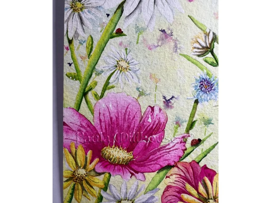 Brown hare sitting among colorful spring wildflowers including tulips and daisies, wildlife watercolor by Paula Millhouse.