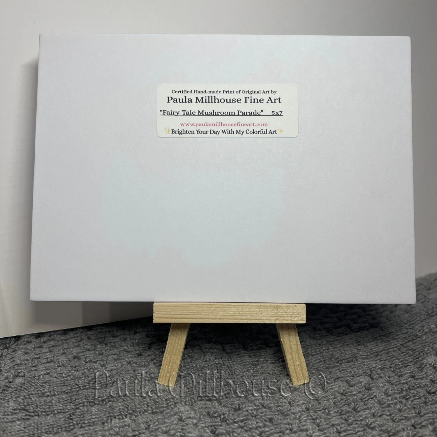 Three cheerful toadstool mushrooms celebrating in a woodland clearing, whimsical watercolor painting by Paula Millhouse.