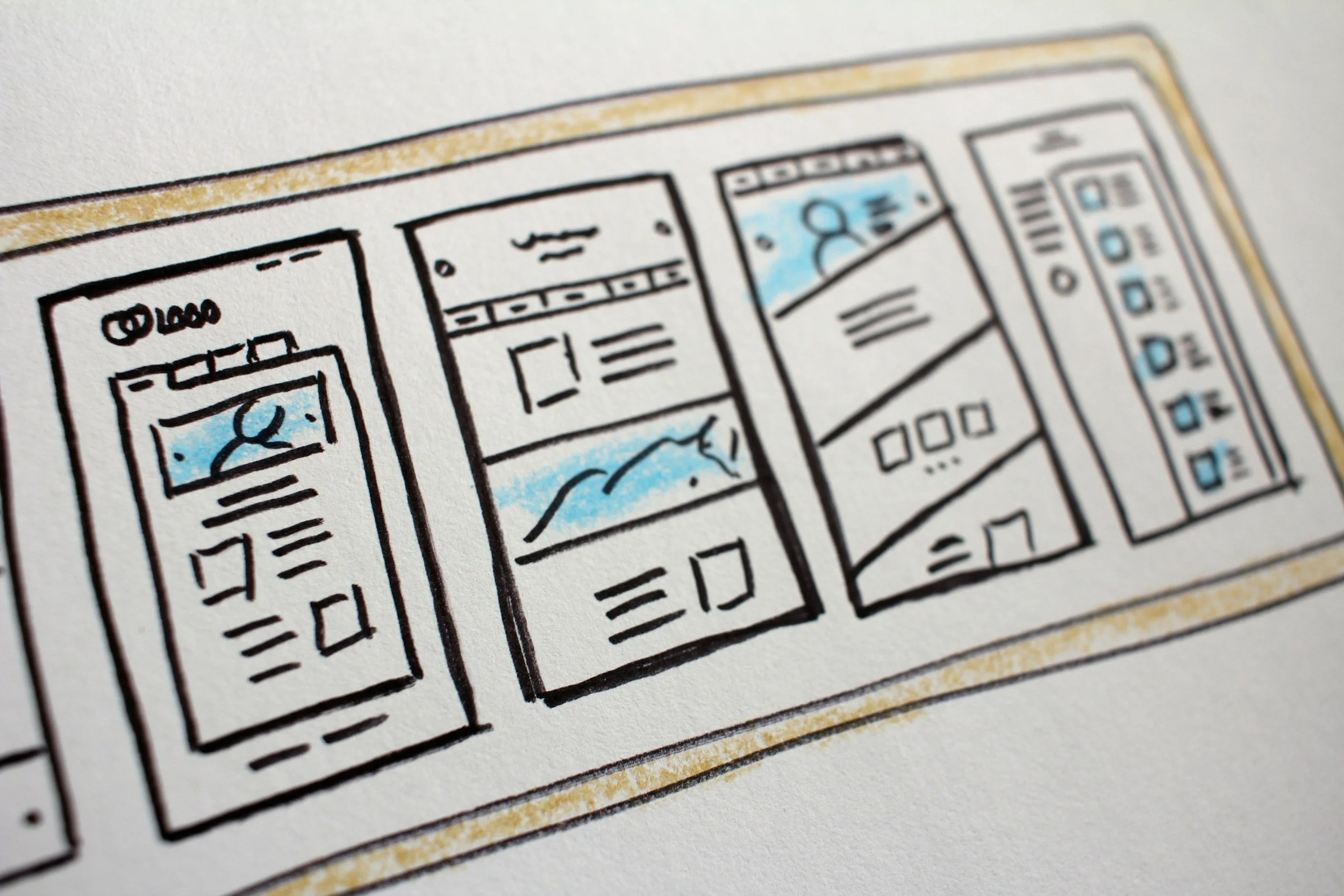 A hand-drawn sketch of a mobile app interface showcasing four different screen layouts, each with various icons and images, some highlighted with light blue.