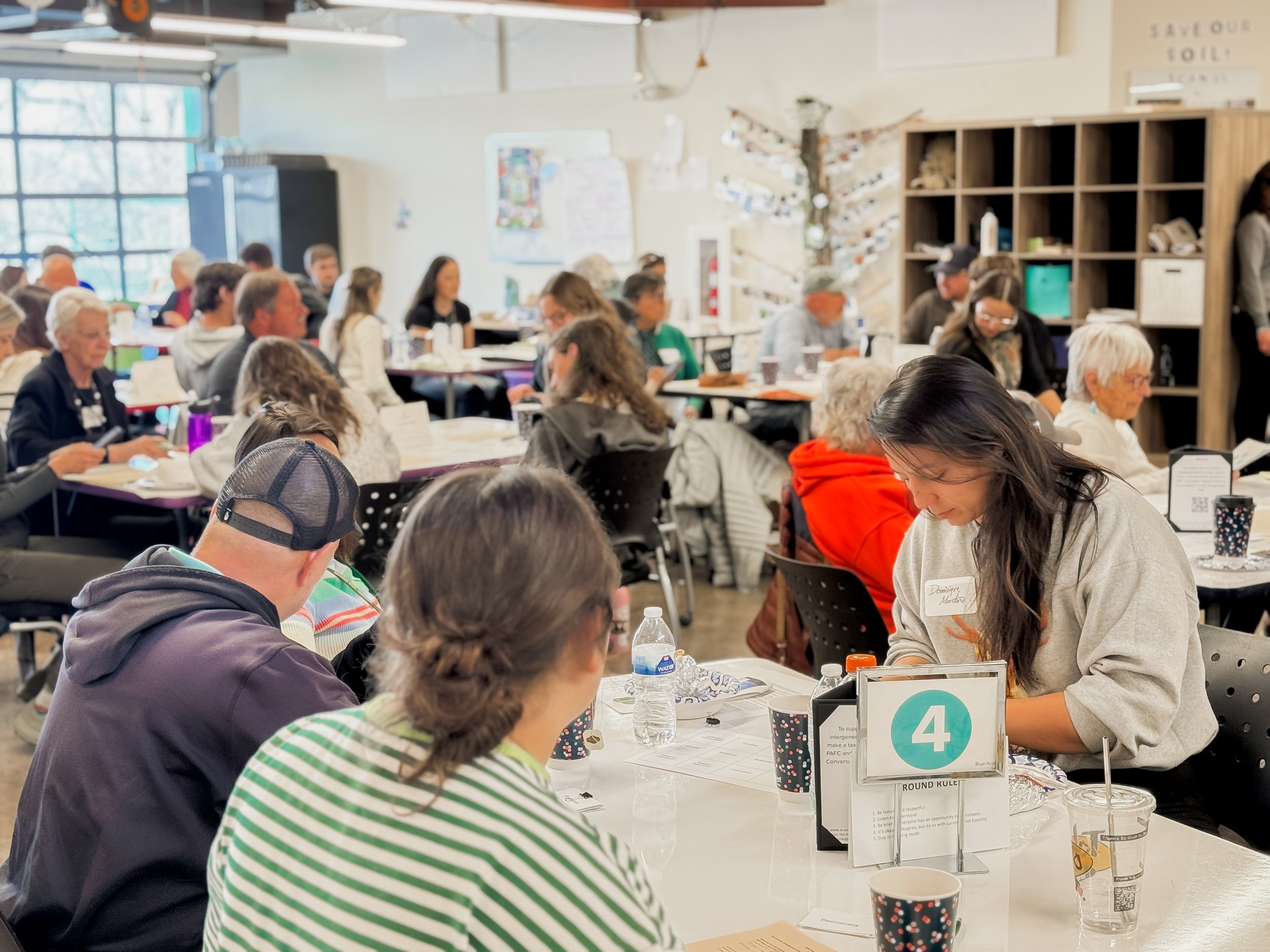 Meeting attendees focus at compass school rental space event venue