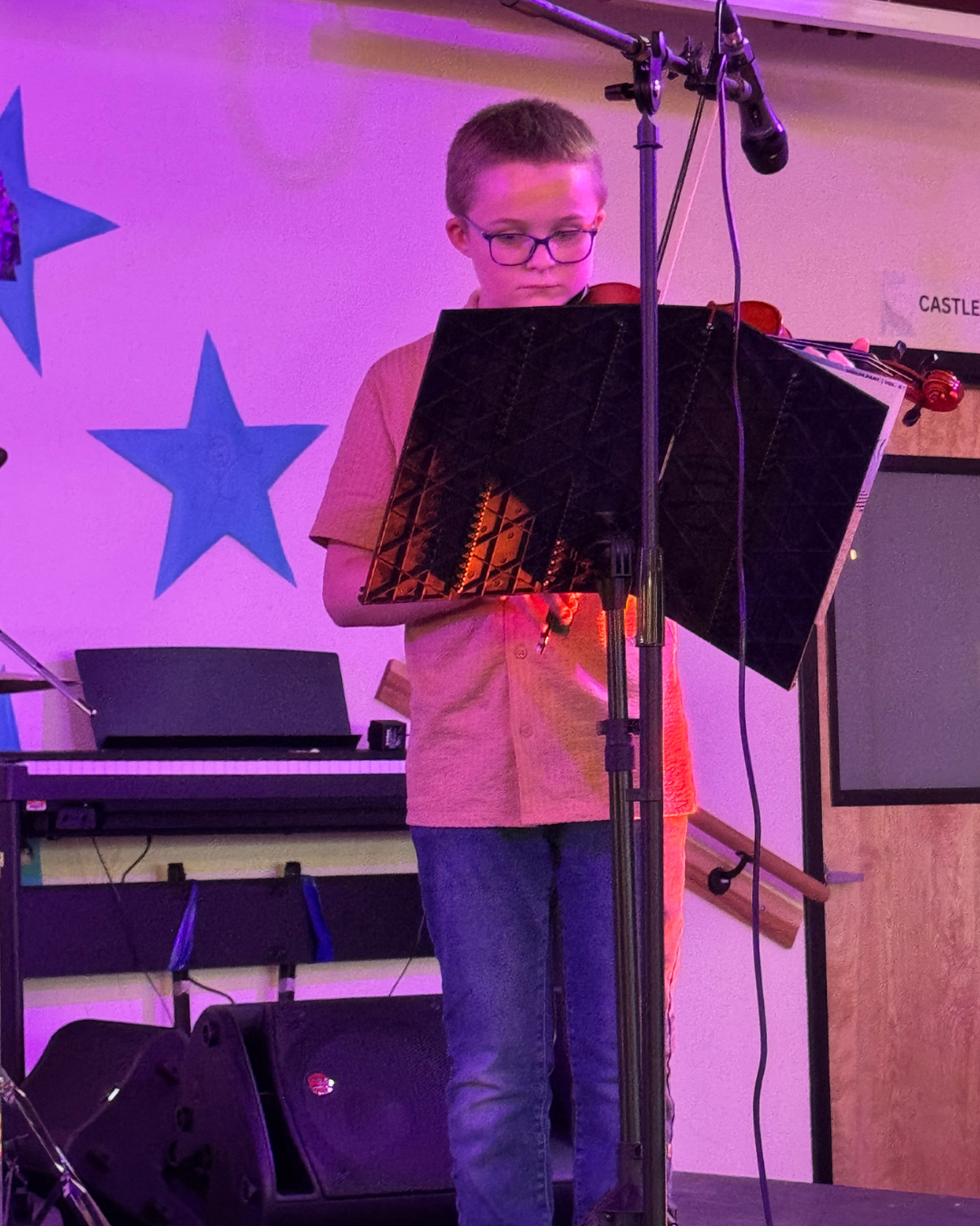 Compass School annual talent show, student playing violin