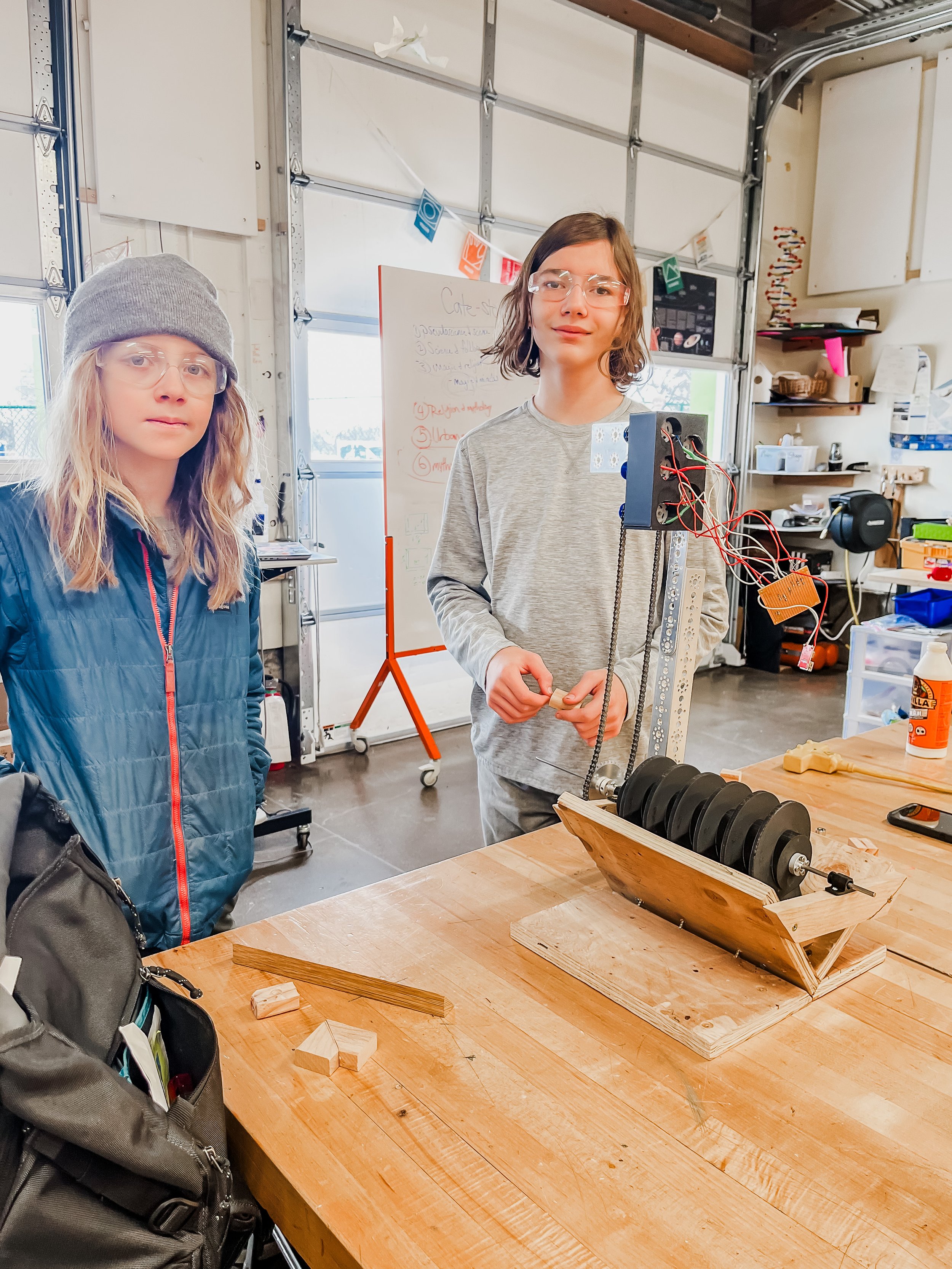 Two Compass Community Collaborative Students present their design for a STEM water tubine