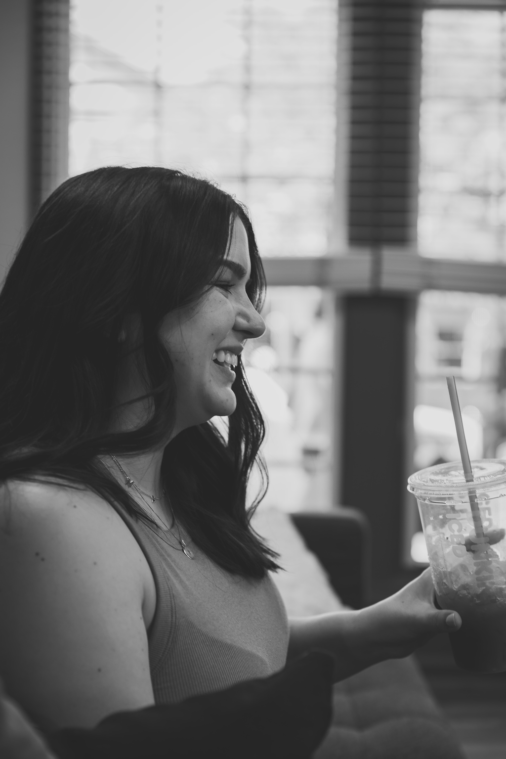 Amanda Crowley, Owner, ACMC, drinking coffee